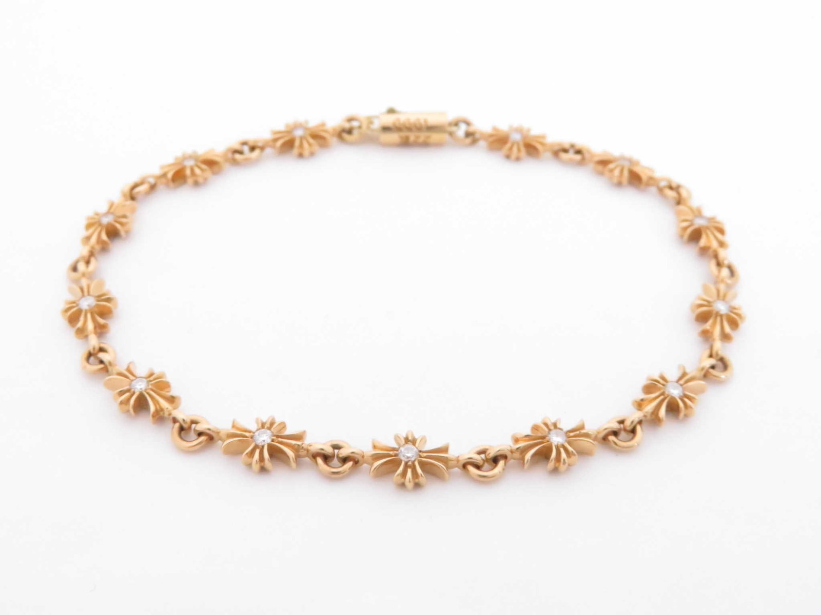 Chrome Hearts Cross Symbol Diamonds Gold Bracelet: Description: Distinctive Chrome Hearts Tiny E bracelet crafted in solid gold, featuring the brand’s signature repeating cross motifs set with diamonds and connected by fine interlocking links. T