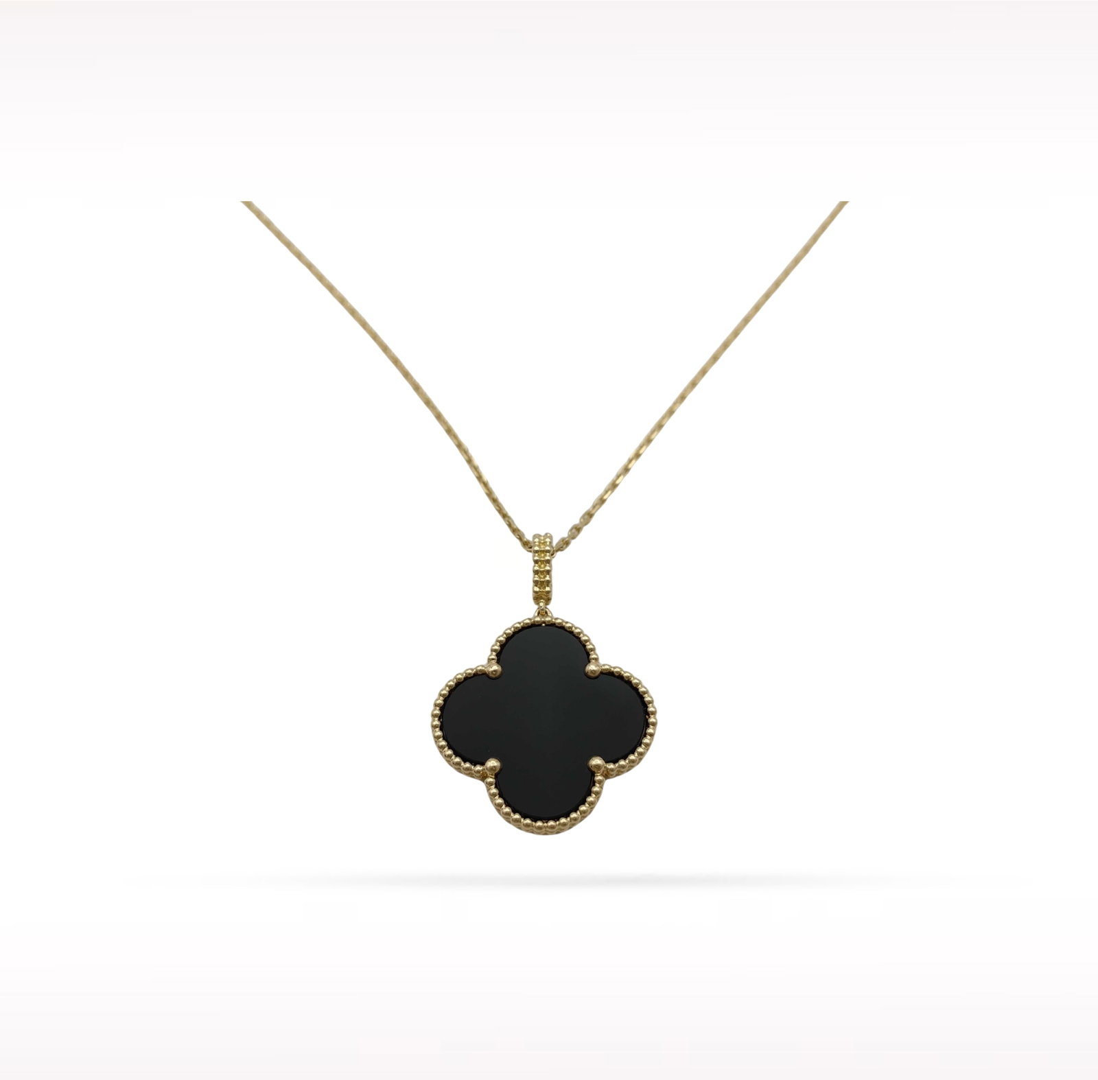 Van Cleef & Arpels Magic Alhambra Black Onyx 18K Yellow Gold Pendant Necklace: Description: Van Cleef & Arpels Magic Alhambra pendant necklace crafted in 18K yellow gold and accented with natural black onyx. From the iconic Magic Alhambra collection, this elegant pendant fea