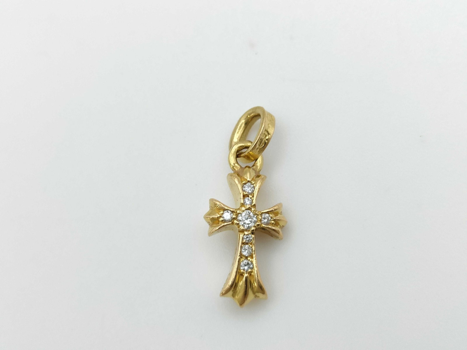 Chrome Hearts Diamond Baby Fat Cross 22K Gold Charm Pendant: Description: Iconic Baby Fat cross charm pendant crafted in solid gold, featuring Chrome Hearts’ signature gothic cross silhouette set with natural diamonds throughout the center. The compact sc