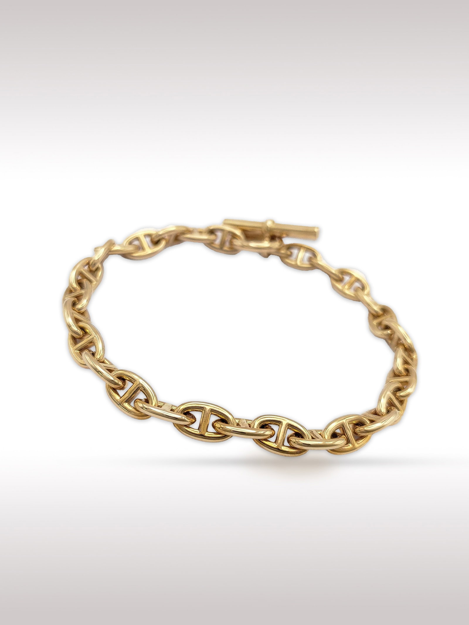 Hermes Chene Dunkle 18K Rose Gold Mariner Link Bracelet: Description: Elegant Hermes Chene Dunkle PM bracelet crafted in solid 18K rose gold, featuring the Maison distinctive chain link design. The sculptural interlocking links create a bold yet refined aes