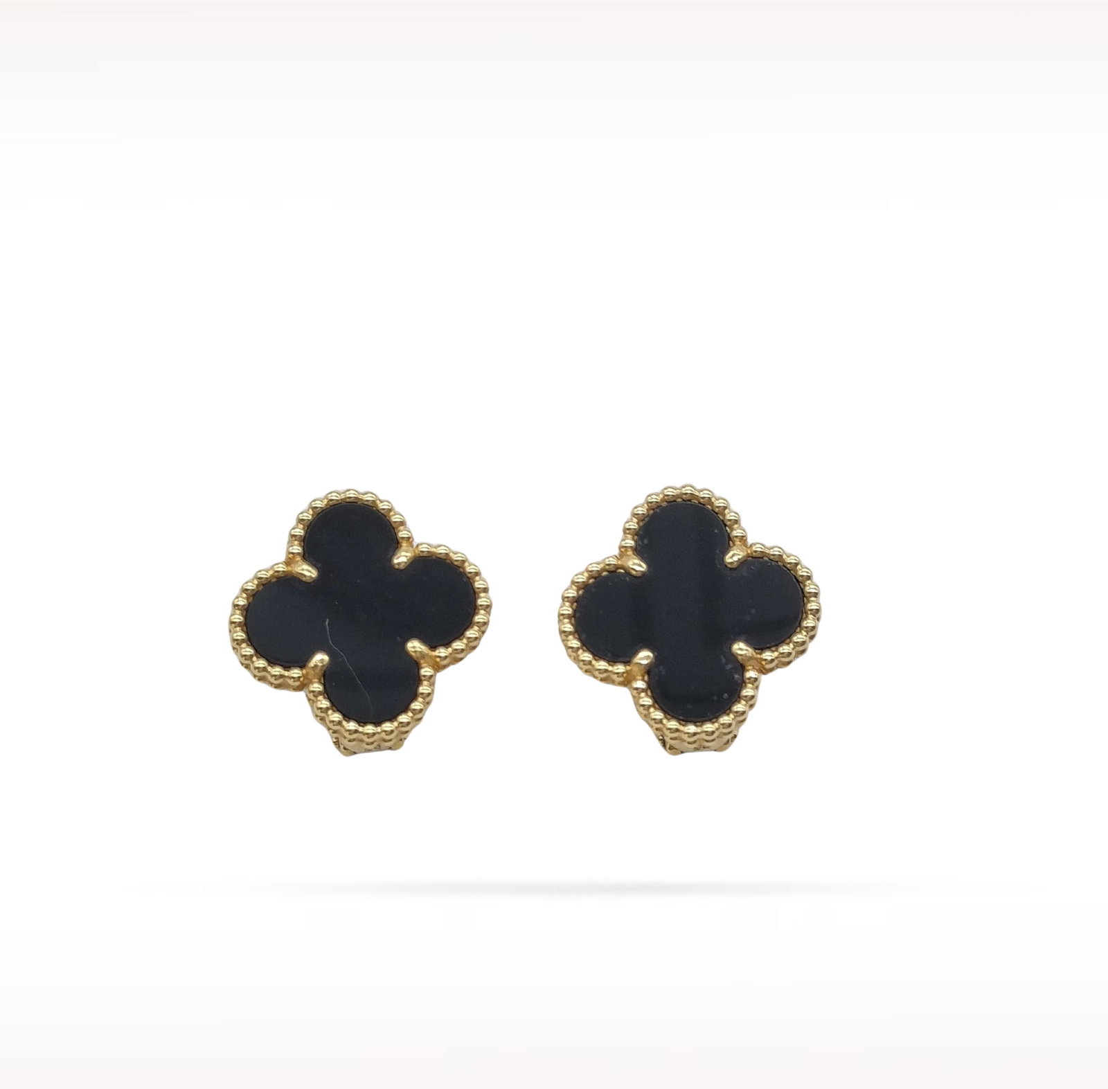 Van Cleef & Arpels Vintage Alhambra Black Onyx 18K Yellow Gold Earrings: Description: Van Cleef & Arpels Vintage Alhambra clip earrings crafted in 18K yellow gold and accented with natural black onyx. From the iconic Vintage Alhambra collection, these elegant earrings 