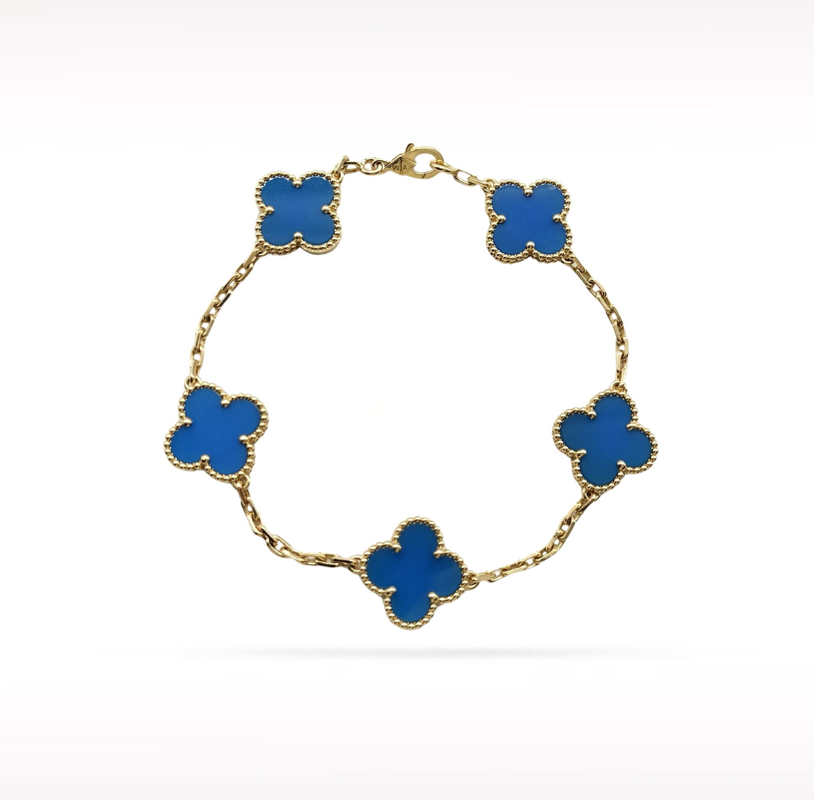 Van Cleef & Arpels Vintage Alhambra Blue Agate 18K Yellow Gold 5 Motif Bracelet: Description: Van Cleef & Arpels Vintage Alhambra 5 Motif bracelet crafted in 18K yellow gold and accented with natural blue agate. From the iconic Vintage Alhambra collection, this elegant bracele