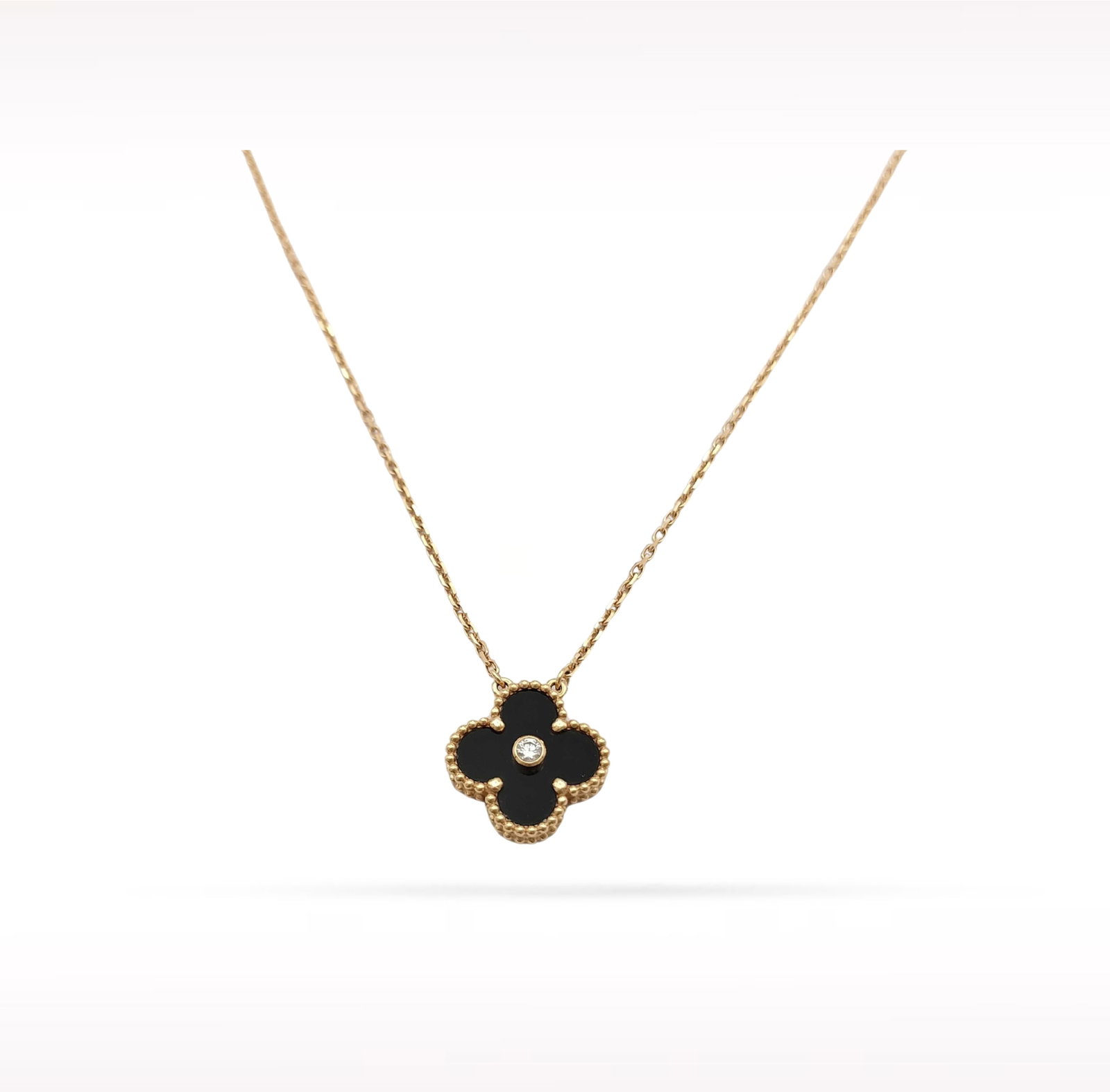 Van Cleef & Arpels Holiday Edition Black Onyx 2016 18K Rose Gold Pendant Necklace: Description: Van Cleef & Arpels Holiday pendant necklace crafted in 18K rose gold and accented with natural black onyx. Released as the 2016 Holiday Limited Edition, this highly collectible piece 