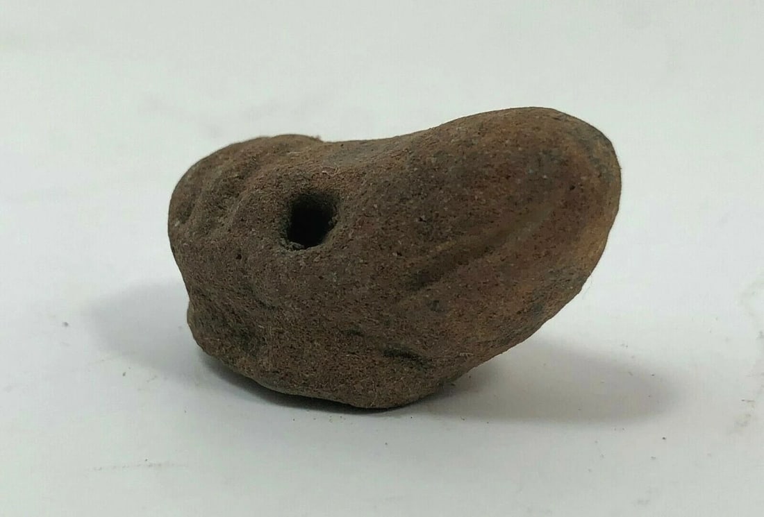Terracotta Boar Head Seal, Greek/Roman 1st BC: Title/Medium: Stone Terracotta Boar Head Seal Origin/Year: Greek or Roman, 1st Millennium BC Dimensions: Approximately 4 inches in height Condition: Weathered, irregular shape, evidence of erosion Pro