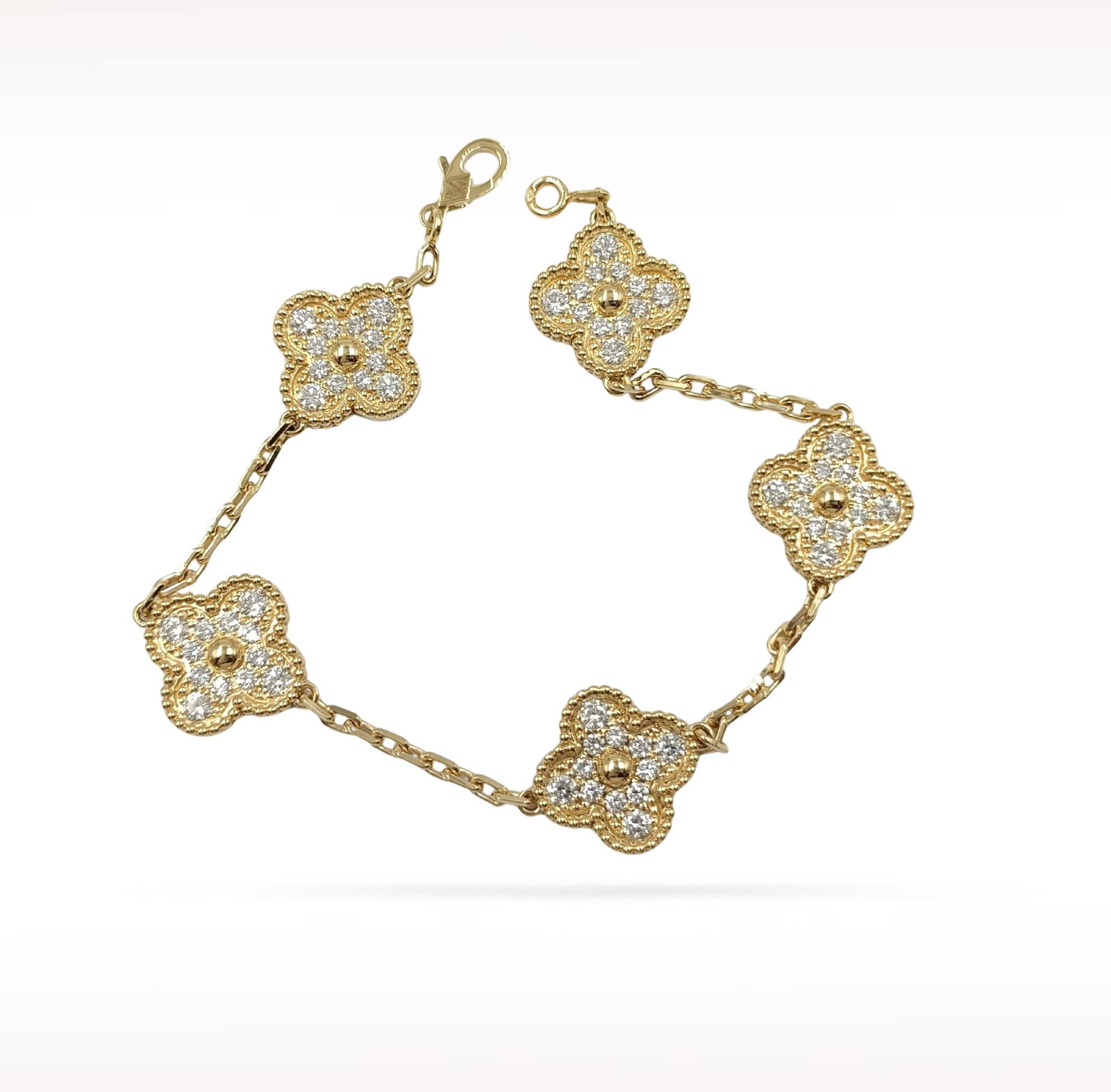 Van Cleef & Arpels Vintage Alhambra Pave Diamond 18K Yellow Gold 5 Motif Bracelet: Description: Van Cleef & Arpels Alhambra 5 Motif bracelet crafted in 18K yellow gold and accented with natural pave set diamonds. From the iconic Alhambra collection, this elegant bracelet feature