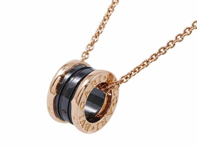 Bulgari Bvlgari B.Zero Black Ceramic & 18K Rose Gold Pendant Necklace: Description: Bulgari B.Zero1 Black Ceramic & 18K Rose Gold Pendant Necklace Sophisticated and modern Bvlgari B.Zero1 pendant necklace combining the brand’s signature 18K rose gold with strik