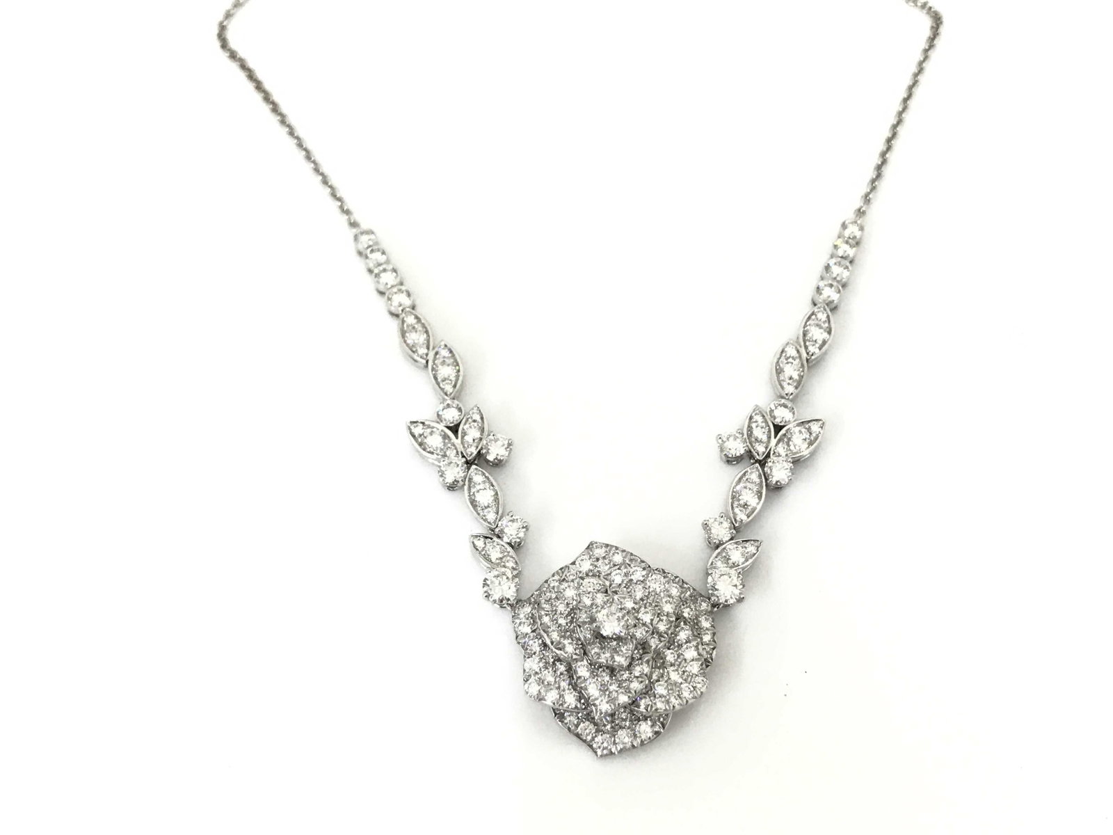 Piaget Large Rose Diamond 18K White Gold Statement Bib Necklace: Description: An exceptional Piaget diamond necklace crafted in solid 18K white gold, featuring an elegant floral-inspired design set with brilliant-cut and marquise diamonds. The sophisticated arrange