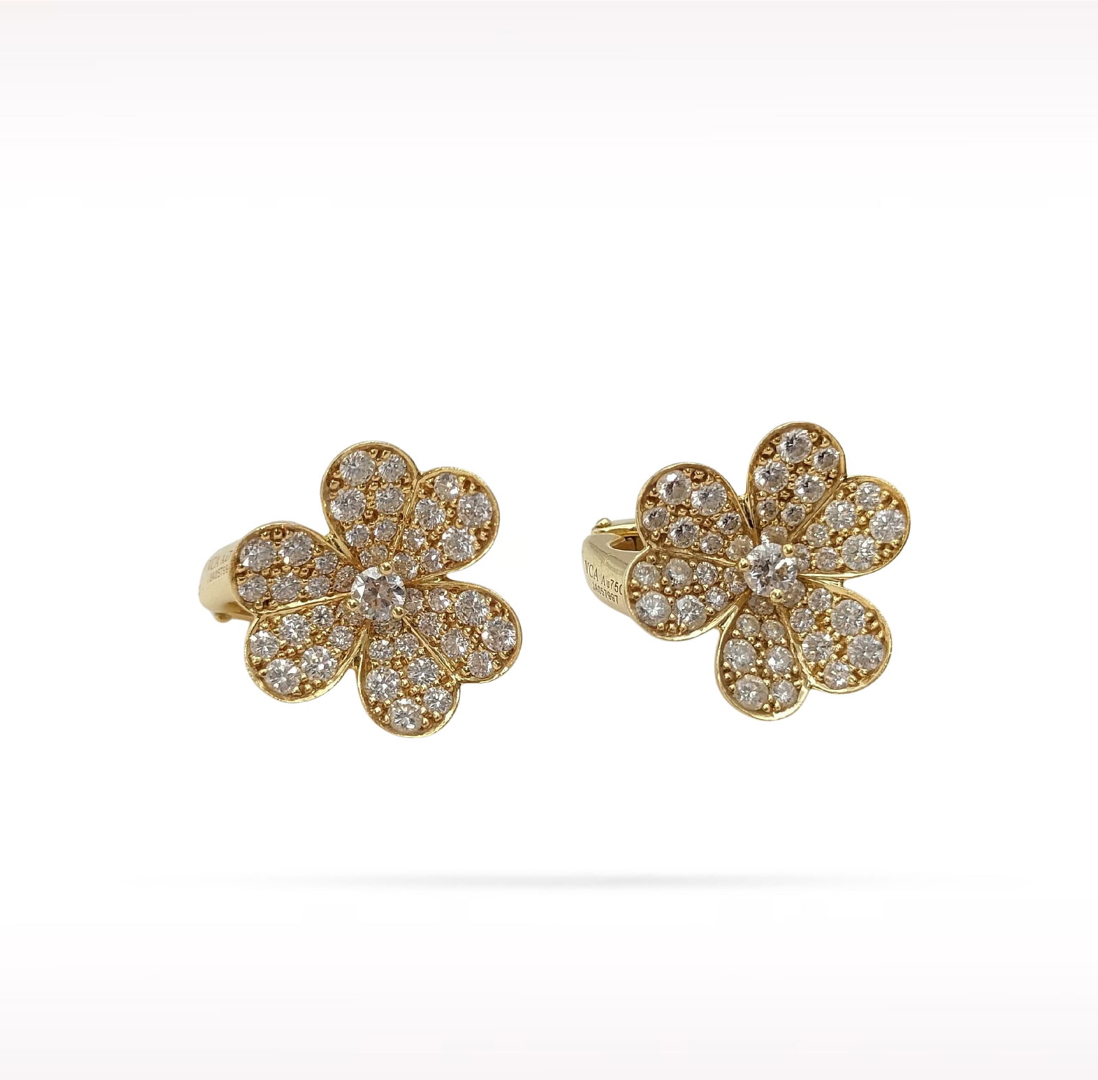 Van Cleef & Arpels Fleurette Diamond 18K Yellow Gold Flower Clip Earrings: Description: Van Cleef & Arpels Fleurette clip earrings crafted in 18K yellow gold and accented with natural diamonds. From the elegant Fleurette collection, these timeless flower earrings feature