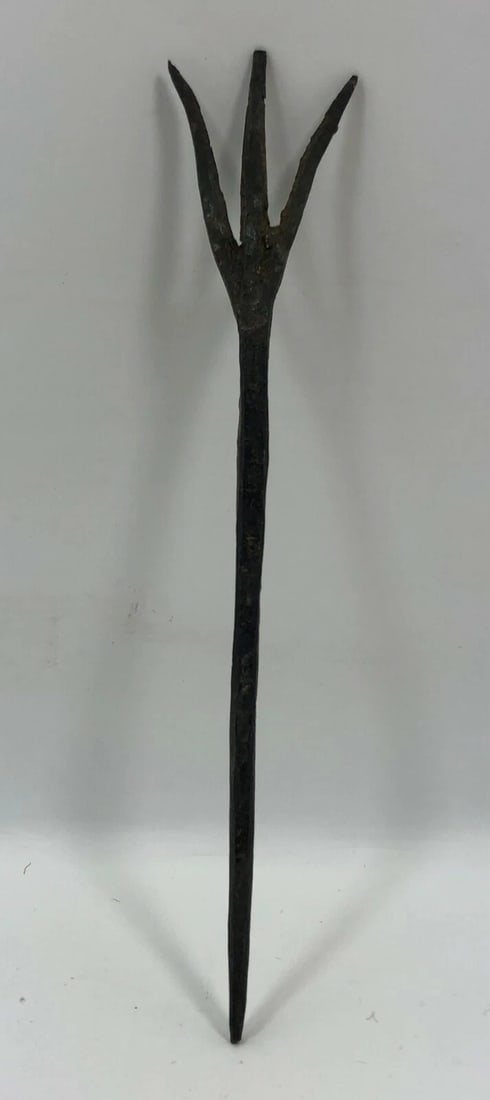 Roman Bronze Fork 2nd Century BC/AD - Antique Tool: Title/Medium: Roman Bronze Fork Origin/Year: Roman Empire, 2nd Century BC/AD Dimensions: Approximately 8 inches in length Condition: Antique, with natural patina and rust Provenance: Acquired from a r
