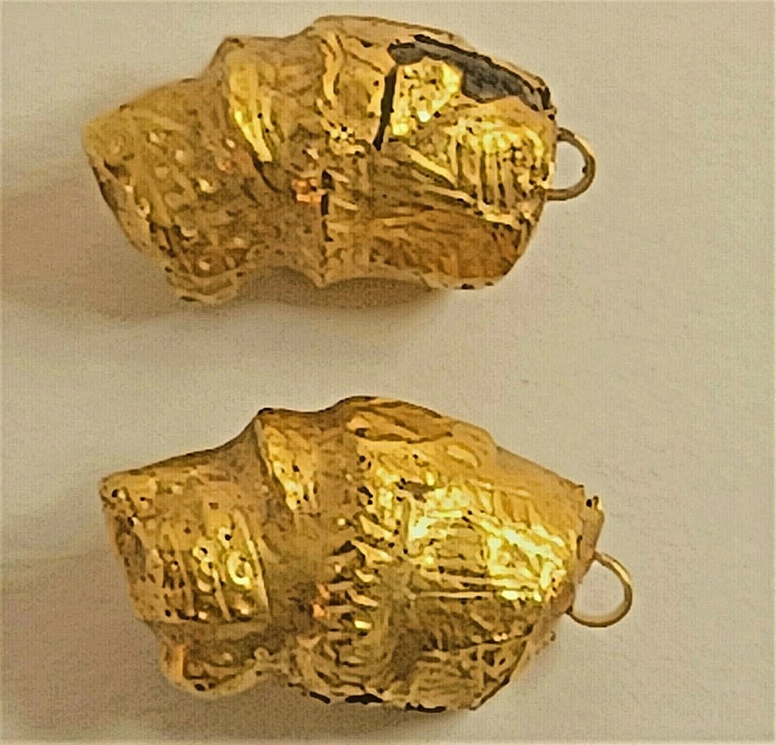 Ancient Gold Lion Head Pendants (2) i mil BC: Title/Medium: Ancient Gold Lion Head Pendants (2) Origin/Year: Greek Phoenician or Achaemenid, 1st millennium BC Dimensions: Varies (exact measurements not provided) Condition: Dull appearance, possib