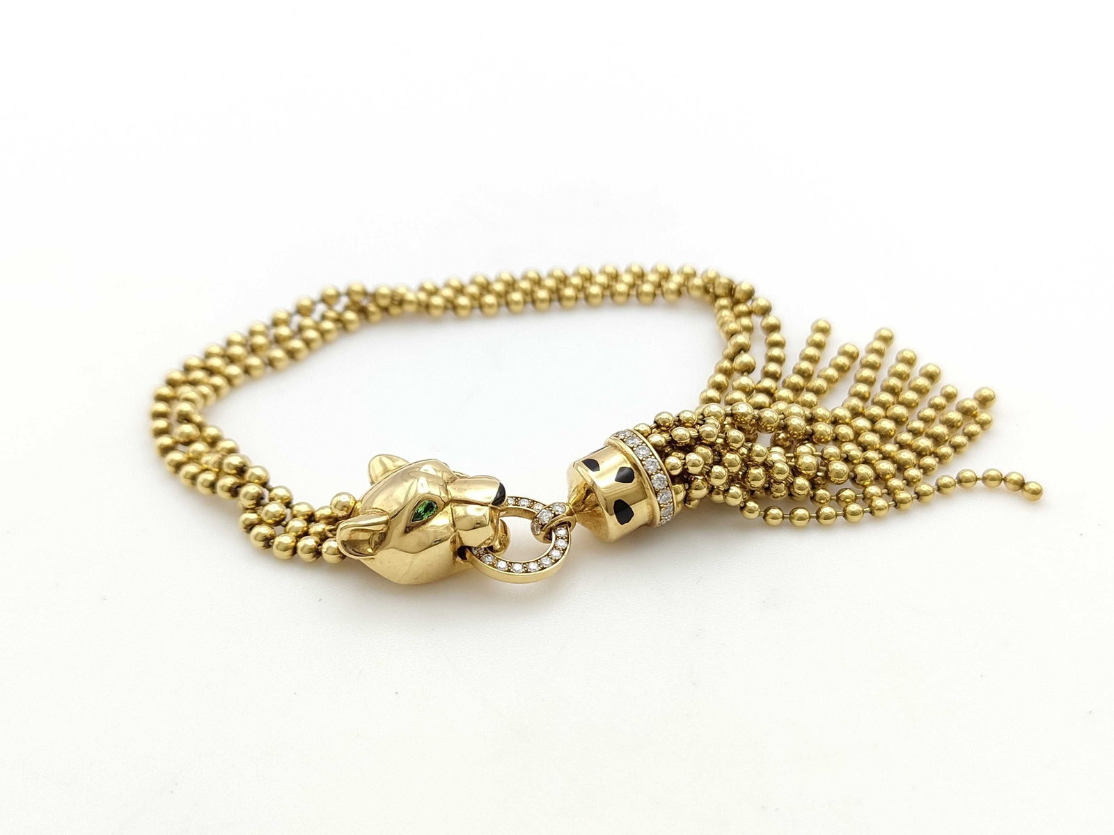 Cartier Panther Leopard Diamond Bead Tassel Unique 18K Gold Bracelet: Description: This exceptional Cartier Panthère bracelet is crafted in solid 18K gold and features the iconic leopard motif, accented with brilliant pavé-set diamonds that create striking bri