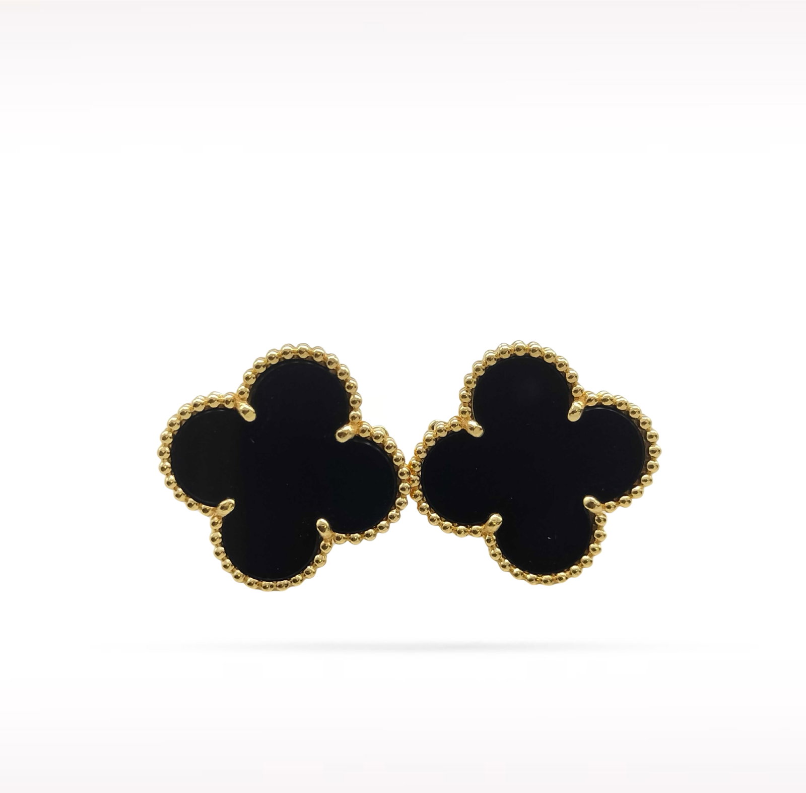 Van Cleef & Arpels Magic Alhambra Black Onyx 18K Yellow Gold Earrings: Description: Van Cleef & Arpels Magic Alhambra earrings crafted in 18K yellow gold and accented with natural black onyx. From the iconic Magic Alhambra collection, these elegant earrings feature t