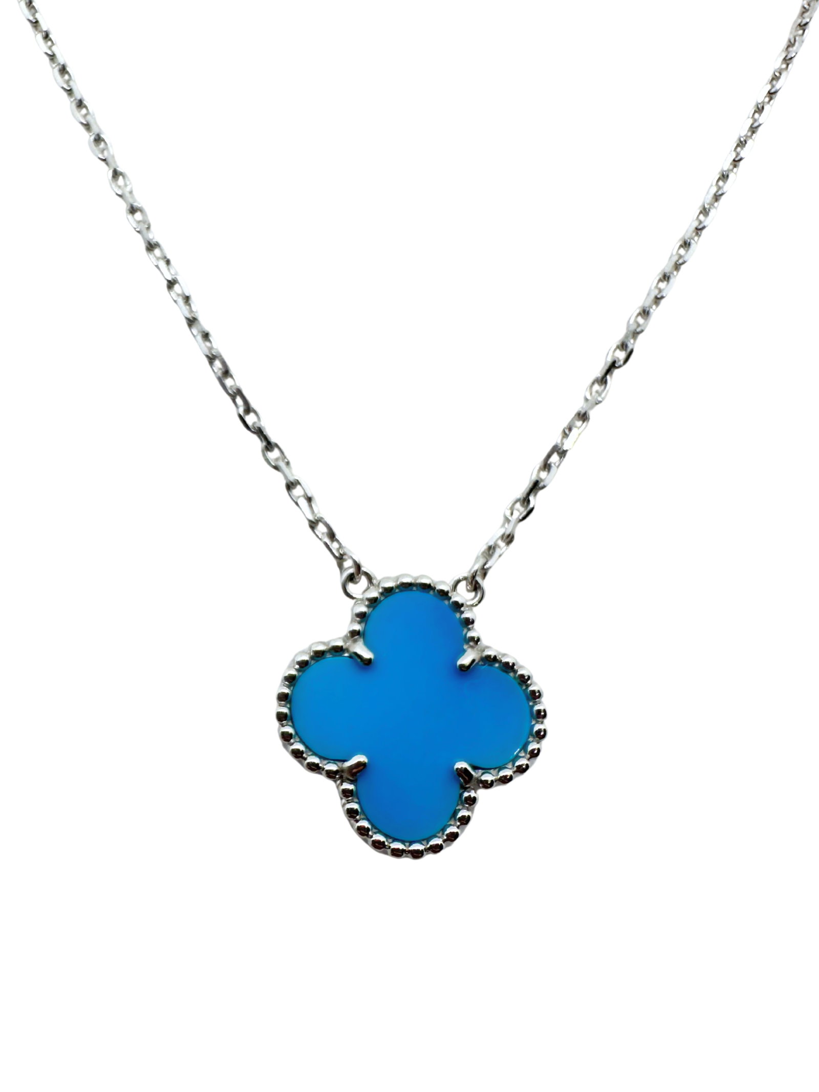 Van Cleef & Arpels Vintage Alhambra Turquoise Pendant Necklace 18K White Gold: Description: Elegant and highly collectible Van Cleef & Arpels Vintage Alhambra pendant necklace crafted in solid 18K white gold (Au750), featuring the Maison’s iconic Alhambra clover motif 