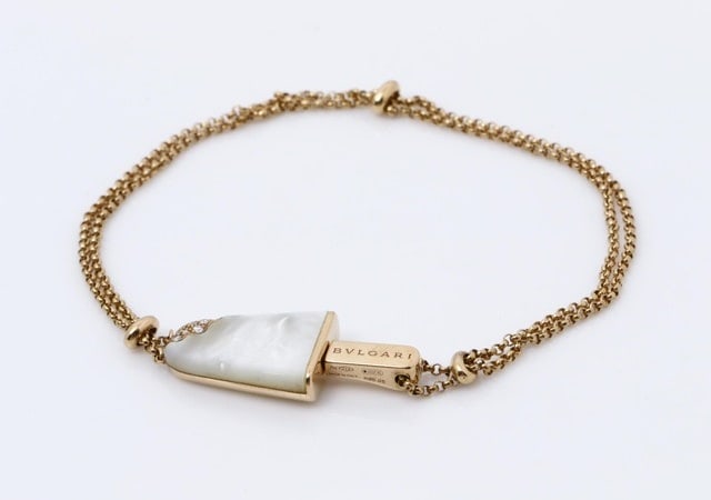 Bulgari Gelati White Mother of Pearl 18K Rose Gold Ice Cream Bracelet: Description: A playful yet luxurious Bulgari Gelati bracelet, finely crafted in solid 18K rose gold (750PG) and featuring a charming ice cream motif inlaid with luminous white Mother of Pearl. This wh