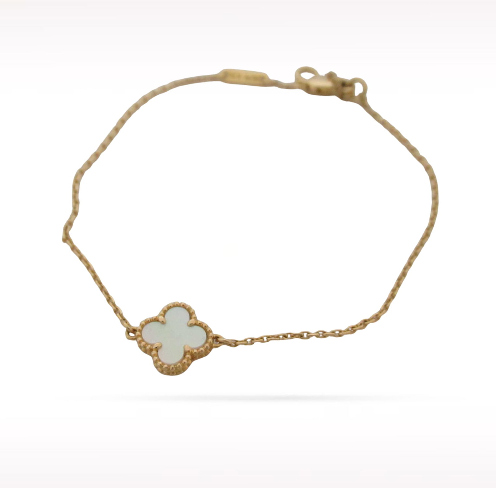 Van Cleef & Arpels Sweet Alhambra White Mother of Pearl 18K Yellow Gold Bracelet: Description: Van Cleef & Arpels Sweet Alhambra bracelet crafted in 18K yellow gold and accented with natural white mother of pearl. From the iconic Sweet Alhambra collection, this elegant bracelet