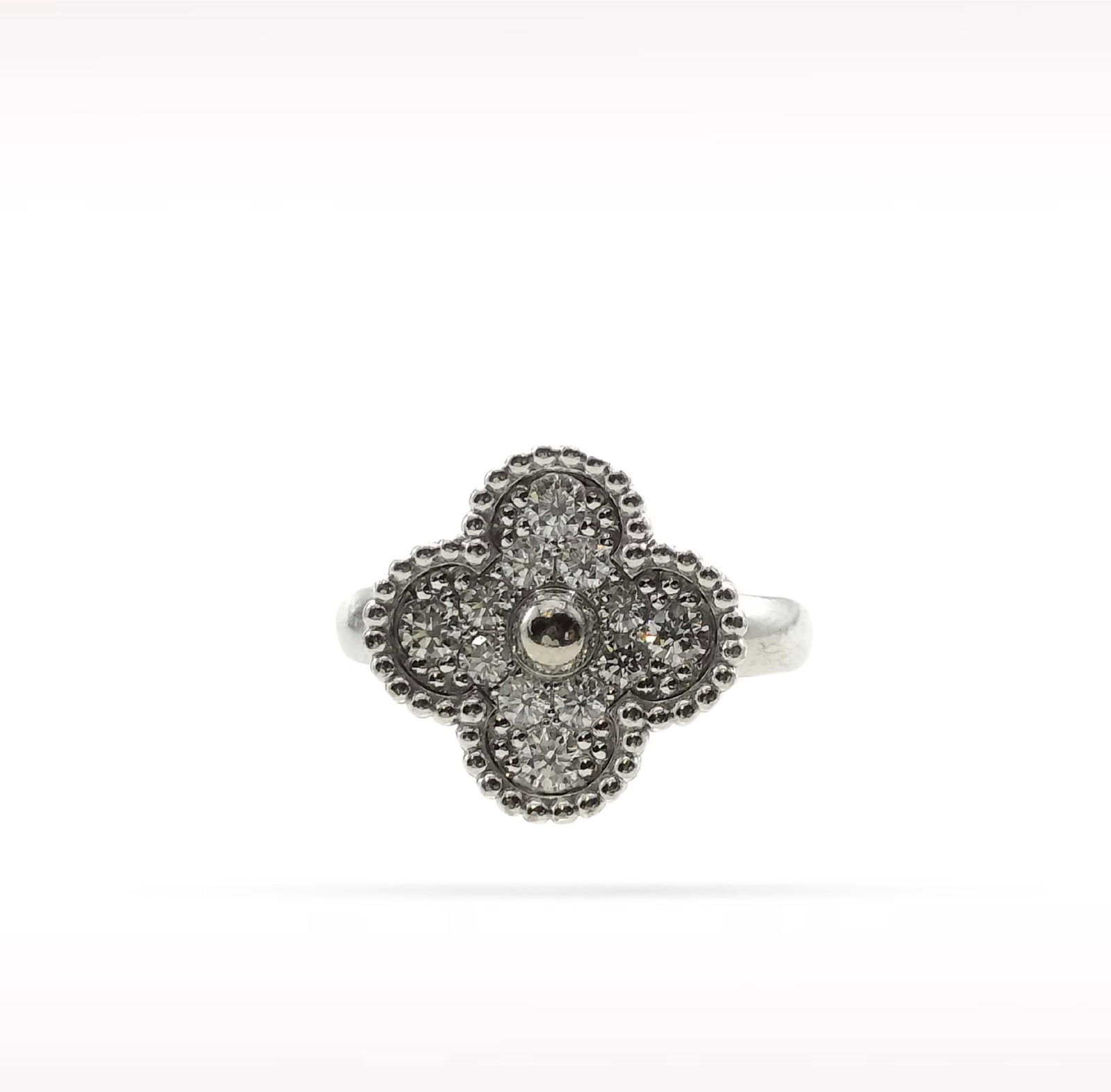 Van Cleef & Arpels Vintage Alhambra Pave Diamond 18K White Gold Ring: Description: Van Cleef & Arpels Alhambra ring crafted in 18K white gold and accented with natural pave set diamonds. From the iconic Alhambra collection, this elegant ring features the maison's si