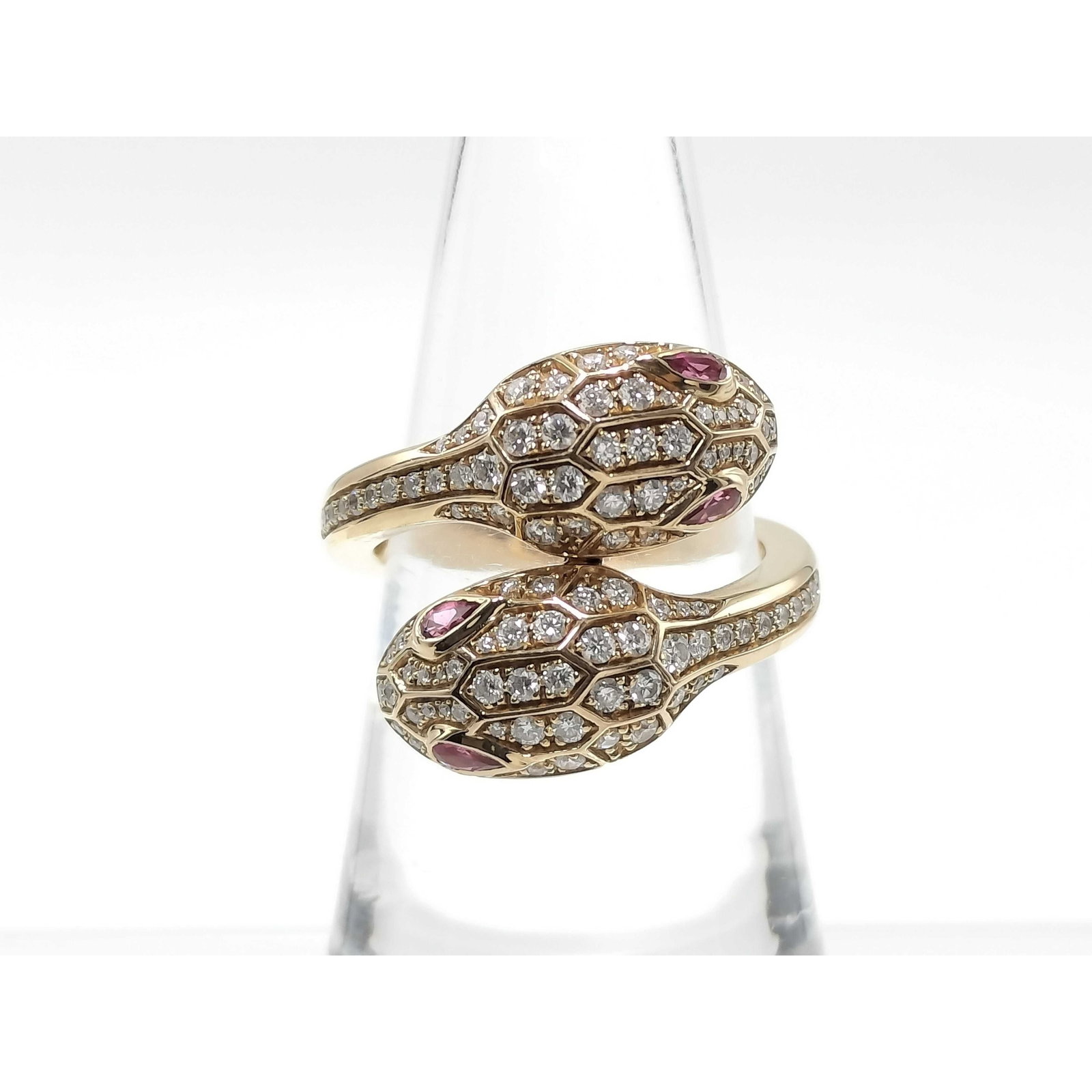 Bvlgari Serpenti Seduttori Diamond Rubellite 18K Rose Gold Ring Size 52: Description: Bvlgari Serpenti Seduttori ring crafted in 18K rose gold and accented with natural diamonds and rubellites. The serpent design combines the brilliance of diamonds with the vibrant color o