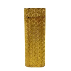 Vintage Cartier Gold Tone Geometric Patterned Metal Lighter: Title/Medium: Vintage Cartier gold tone patterned metal lighter. Origin/Year: Cartier Paris; vintage period. Exact date of manufacture not provided. Dimensions: Not provided. Condition: Pre-owned vint