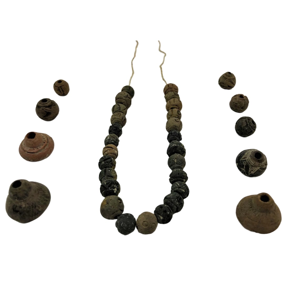 Ancient Near Eastern/Egyptian Clay Necklace: Title/Medium: Near Eastern/Egyptian Ceramic Necklace Origin/Year: Ancient Near East or Egypt Dimensions: Varies per bead, necklace length approximately X inches Condition: Excellent, with minor signs 