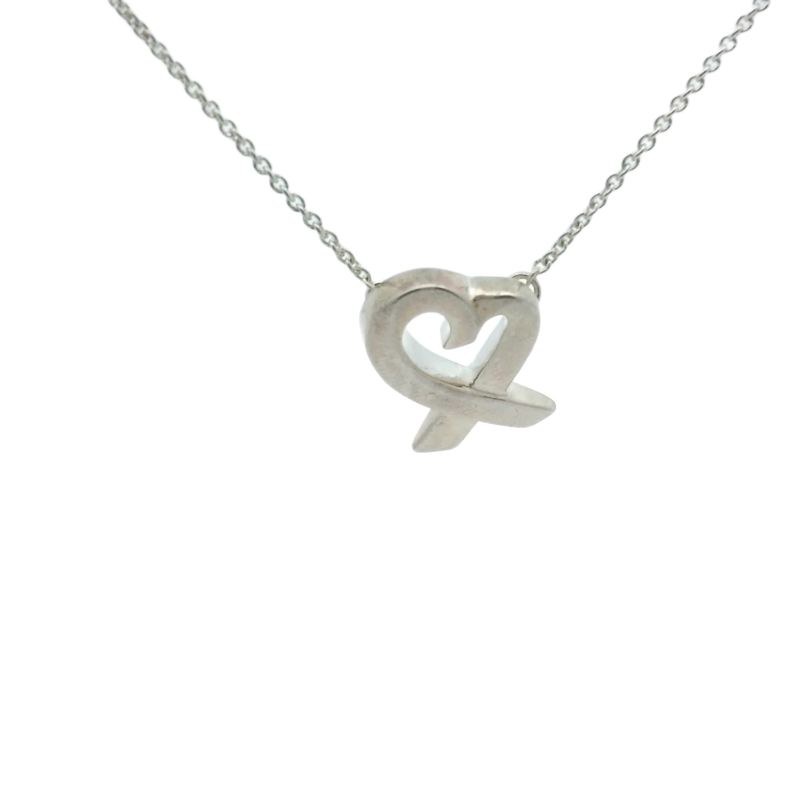 Tiffany & Co. Paloma Picasso Loving Heart Sterling Silver Necklace: Title/Medium Tiffany & Co. Paloma Picasso Loving Heart necklace in 925 sterling silver. Origin/Year Tiffany & Co.; designed by Paloma Picasso. Exact year of manufacture is not specified. Dimen