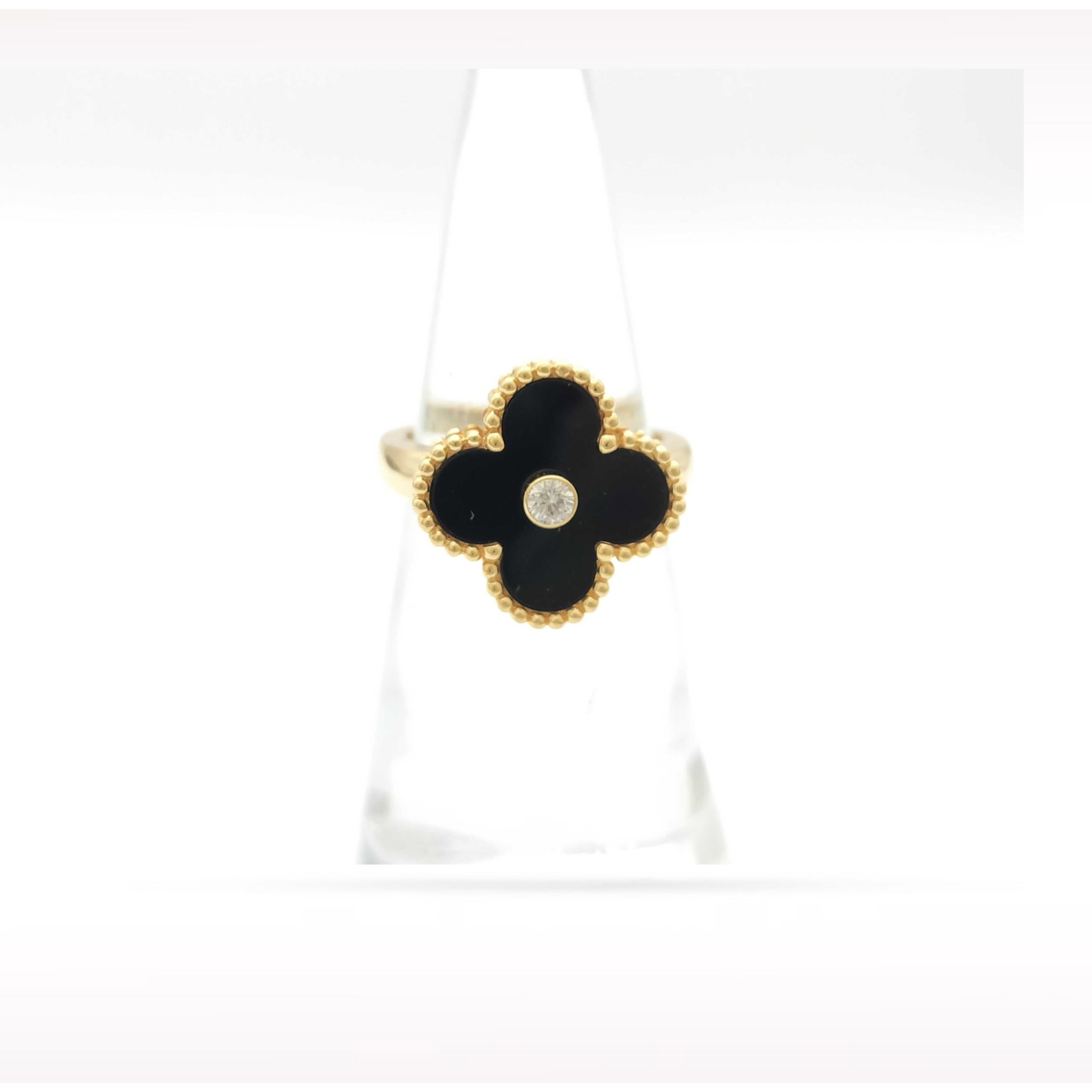 Van Cleef & Arpels Alhambra Diamond Black Onyx 18K Yellow Gold Ring: Description: Van Cleef & Arpels Alhambra ring crafted in 18K yellow gold and accented with natural black onyx and brilliant diamonds. From the iconic Alhambra collection, this elegant ring