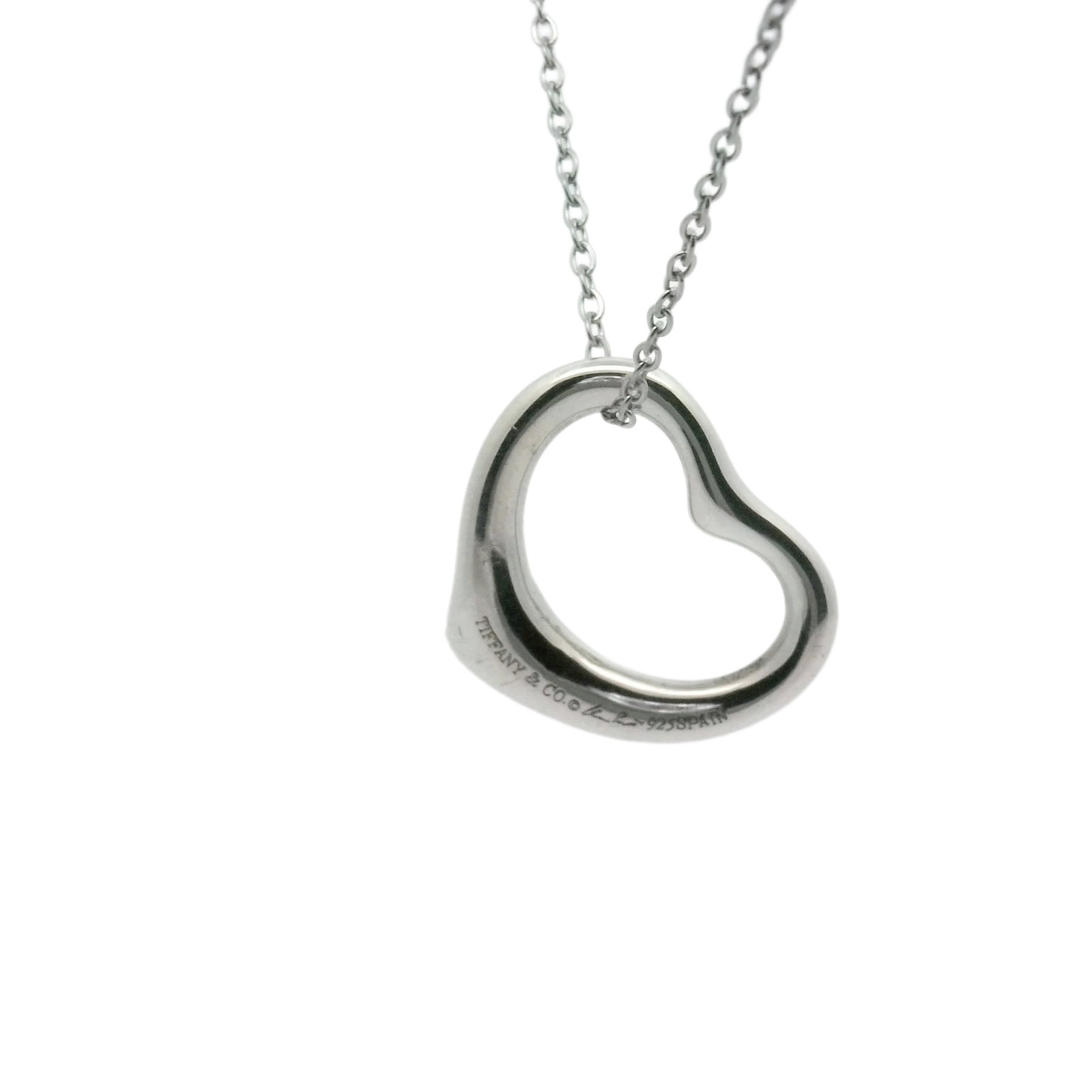 Tiffany & Co. Open Heart 925 Sterling Silver Pendant Necklace: Title/Medium: Tiffany & Co. Open Heart pendant necklace in polished 925 sterling silver. Origin/Year: Tiffany & Co.; year not specified. Dimensions: Dimensions not provided. Condition: