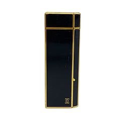 Vintage Cartier Black Lacquer and Gold Tone Rectangular Lighter: Title/Medium: Vintage Cartier black lacquer-style and gold tone metal rectangular lighter. Origin/Year: Cartier Paris; vintage period. Dimensions: Not provided. Condition: Pre-owned vintage