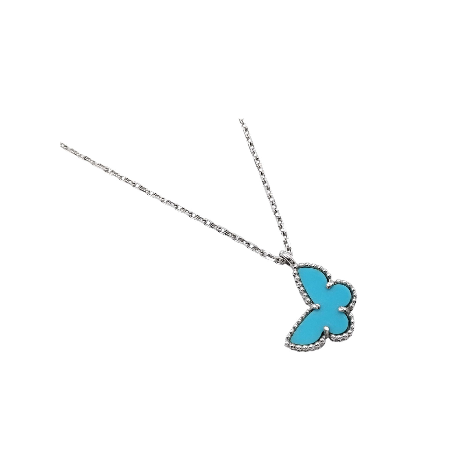 Van Cleef & Arpels Sweet Alhambra Papillon Turquoise 18K White Gold Pendant Necklace: Description: Van Cleef & Arpels Sweet Alhambra Papillon pendant necklace crafted in 18K white gold and accented with natural turquoise. From the iconic Sweet Alhambra collection, this elegant neck