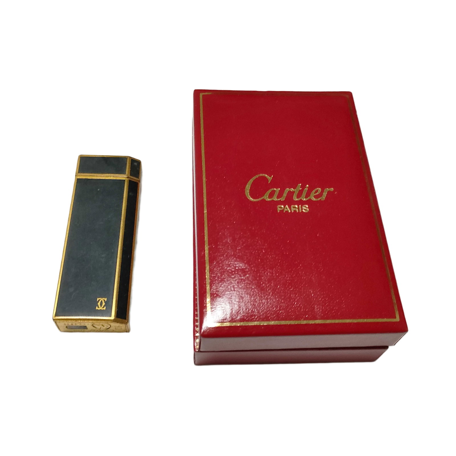 Vintage Cartier Black and Gold Tone Metal Rectangular Lighter with Box: Title/Medium: Vintage Cartier black and gold tone metal rectangular lighter Origin/Year: Cartier; vintage period Dimensions: Not provided Condition: Pre-owned vintage condition with surface wear, scra