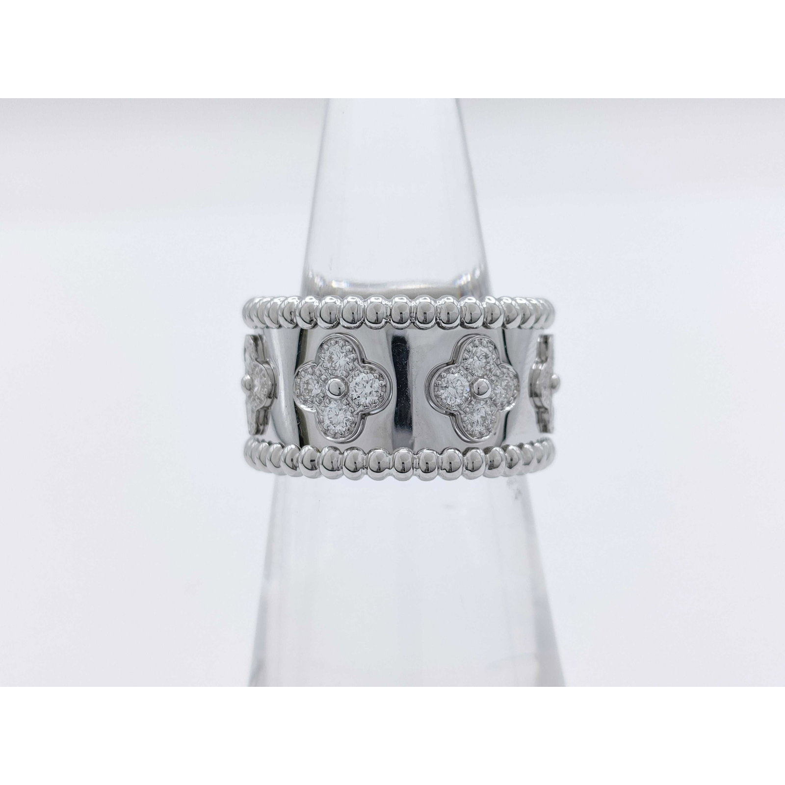 Van Cleef & Arpels Perlee Diamond Clover 18K White Gold Ring: Description: This elegant Van Cleef & Arpels Perlee Clover ring is crafted in solid white 18K gold and features the signature clover motif accented with brilliant diamonds. The refined design high