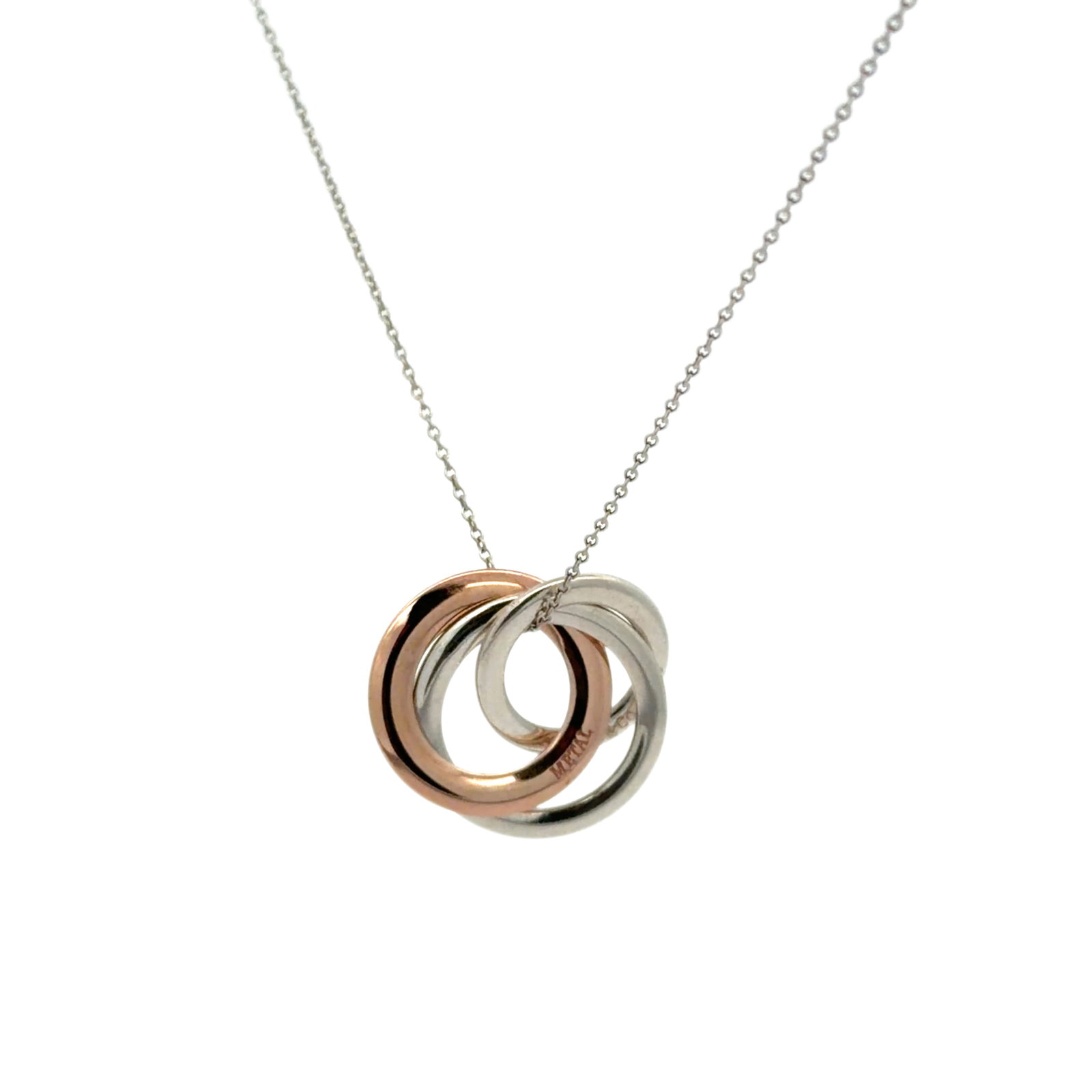 Tiffany & Co. Interlocking Three Ring Necklace in Rose Metal and Sterling Silver: Title/Medium: Tiffany & Co. interlocking three ring pendant necklace in 925 sterling silver and rose metal. Origin/Year: Tiffany & Co.; year not specified. Dimensions: Dimensions not provided. Conditi