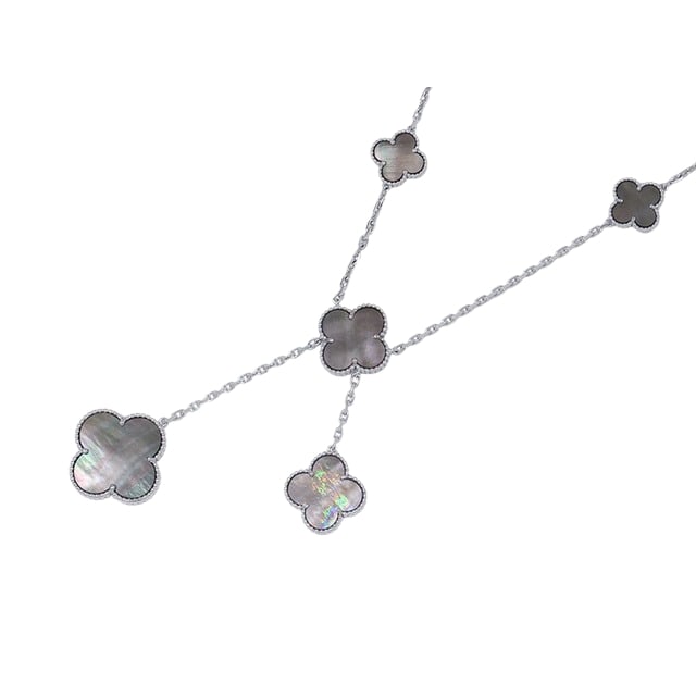 Van Cleef & Arpels Magic Alhambra 6 Motifs Grey Mother of Pearl 18K White Gold Bib Necklace: Description: Van Cleef & Arpels Magic Alhambra bib necklace crafted in 18K white gold and featuring six iconic Alhambra motifs set with grey mother of pearl. Showcasing the Maison's celebrated clo