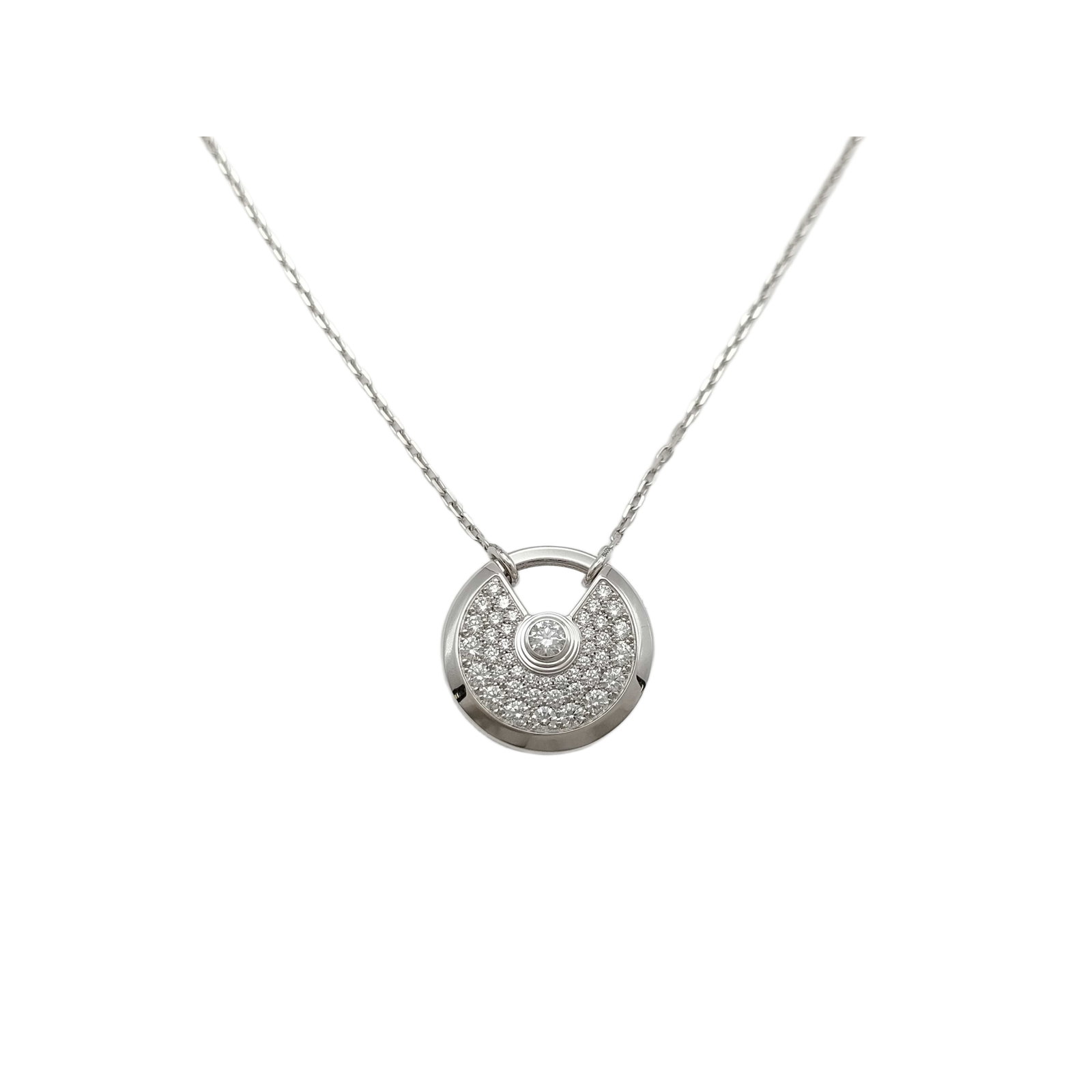 Cartier Amulette Diamond Pave Large 18K White Gold Pendant Necklace: Description: This elegant Amulette de Cartier Large pendant necklace is crafted in solid 18K white gold and features brilliant pavé-set diamonds within the collection’s iconic circular desi