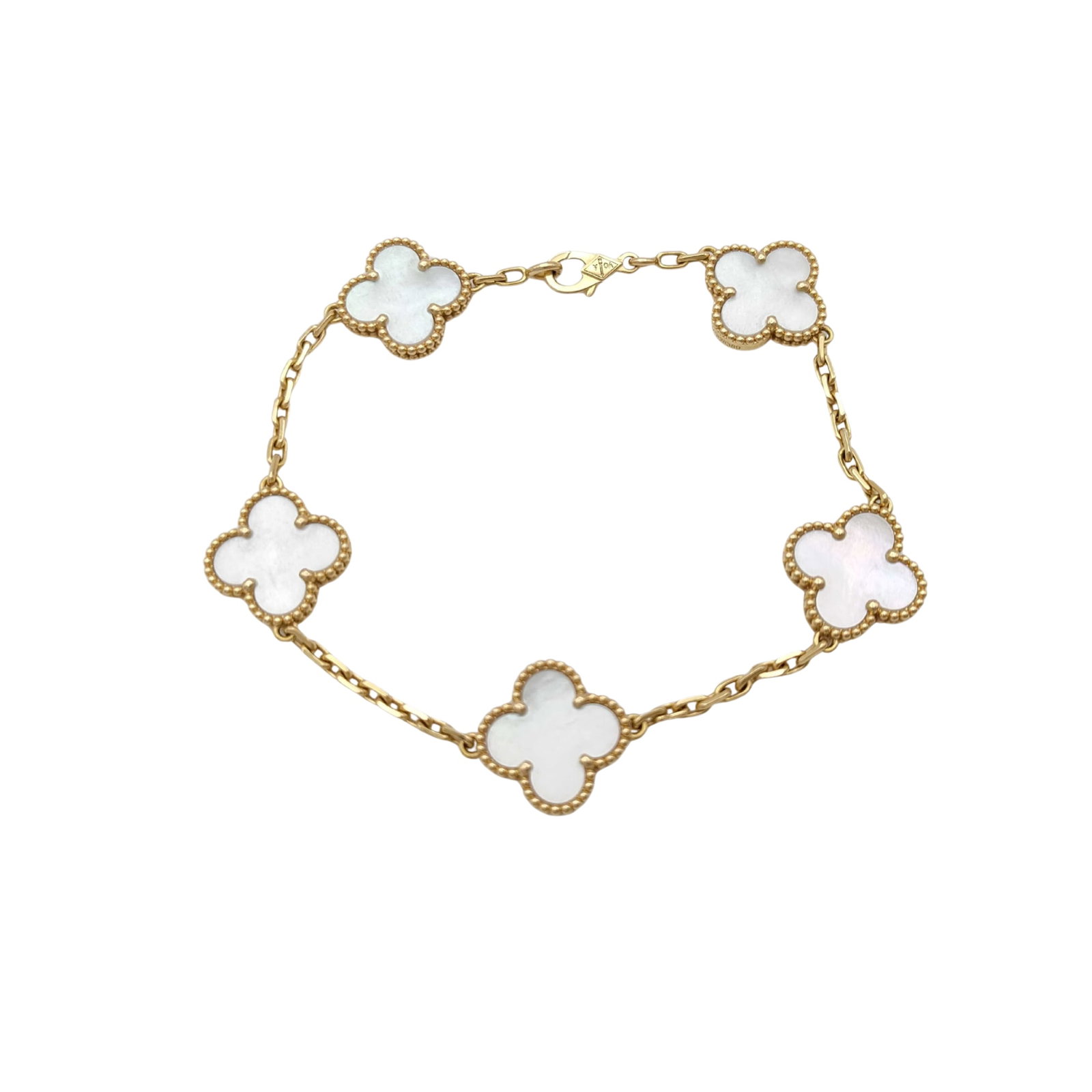 Van Cleef & Arpels Vintage Alhambra White Mother of Pearl 18K Yellow Gold 5 Motif Bracelet: Description: Van Cleef & Arpels Vintage Alhambra 5 Motif bracelet crafted in 18K yellow gold and accented with natural white mother of pearl. From the iconic Vintage Alhambra collection, this eleg