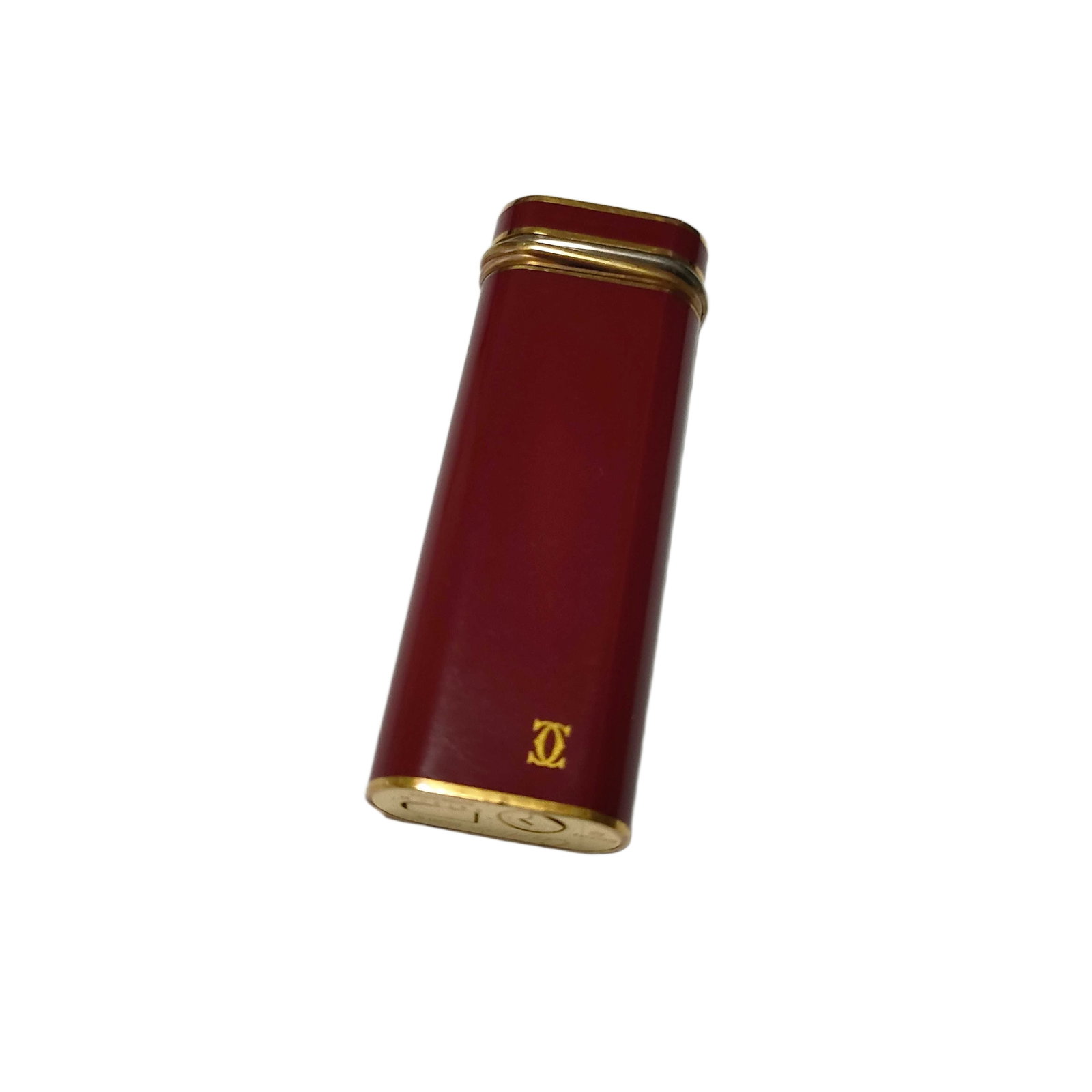 Vintage Cartier Red Lacquer and Gold Tone Metal Rectangular Lighter: Title/Medium: Vintage Cartier red lacquer-style and gold tone metal rectangular lighter. Origin/Year: Cartier; vintage period. Dimensions: Dimensions not provided. Condition: Pre-owned vintage conditi