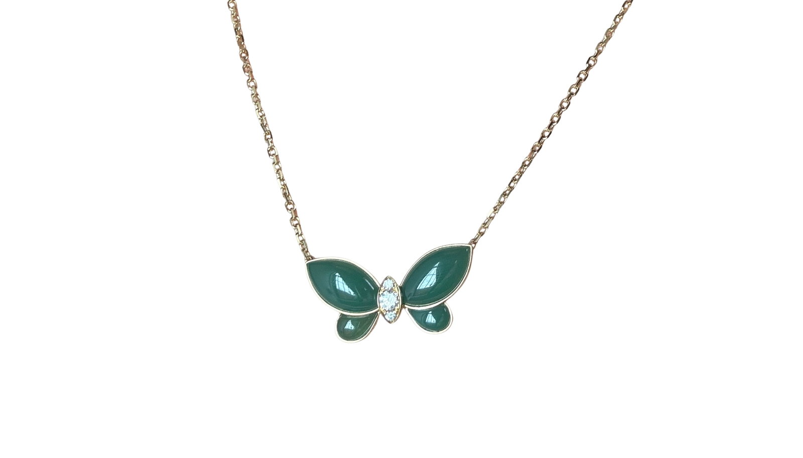 Van Cleef & Arpels Vintage Butterfly Green Chalcedony Diamond 18K Yellow Gold Pendant Necklace: Description: Rare vintage Van Cleef & Arpels Butterfly pendant necklace crafted in 18K yellow gold, featuring polished green chalcedony wings and a diamond-set center. The sculptural butterfly design 