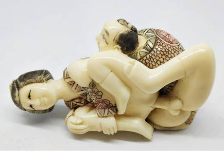 A Japanese erotic bone statue: Red and black engravings length- 6 cm period- 20th century