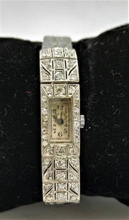 Art Deco - platinum and diamond watch: A platinum watch set with 58 diamonds weigh all in all 1.5 carat. Strap and mechanism are not the original ones and it at the moment doesn't work. weight- 14.5 gram