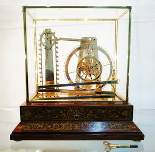 French mystery water wheel ball bearing industrial: French mystery water wheel ball bearing industrial clock by the artiest Peter Bonnert, having a brass movement with ball bearings revolving around the clear dial with Roman markers, housed in a highly