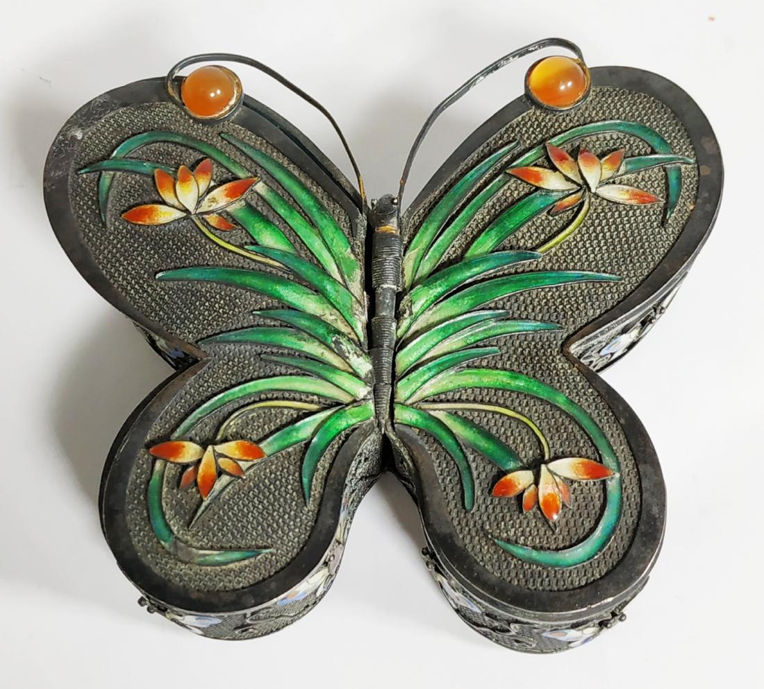 silver Chinese box in the shape of a butterfly: A storage box in the shape of butterfly , silver delicate filigree work, colorful enamel and set with carnelian stones; two-sided box each wing opens the inside is covered in a blue enamel period- 193