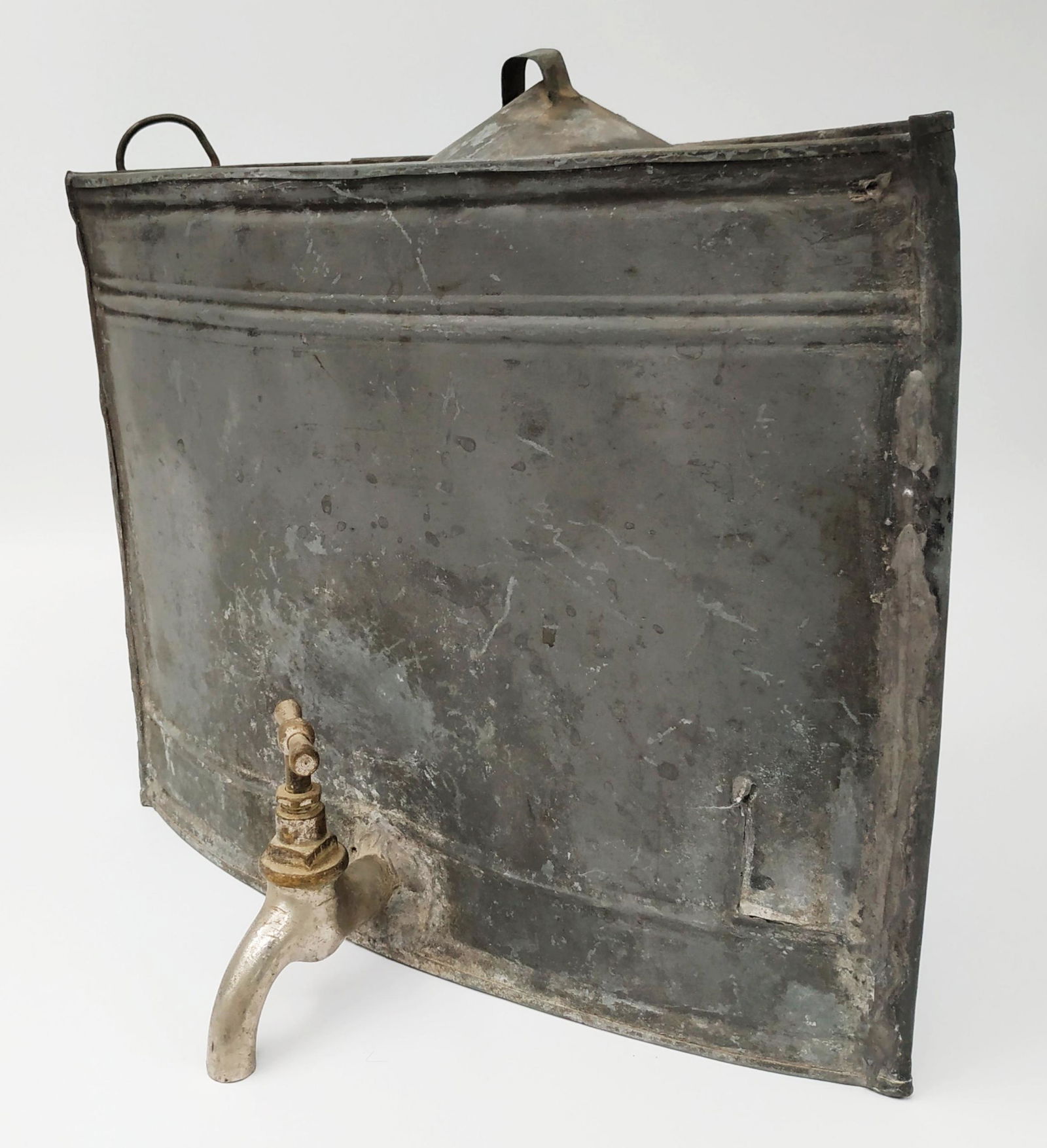 A water tap for Cohanim: Old water container that was for the cohanim to wash there hands in the synagogue. A tin container with a tap in the center , a opening lid to allow the water in and two hoops on the back in order to
