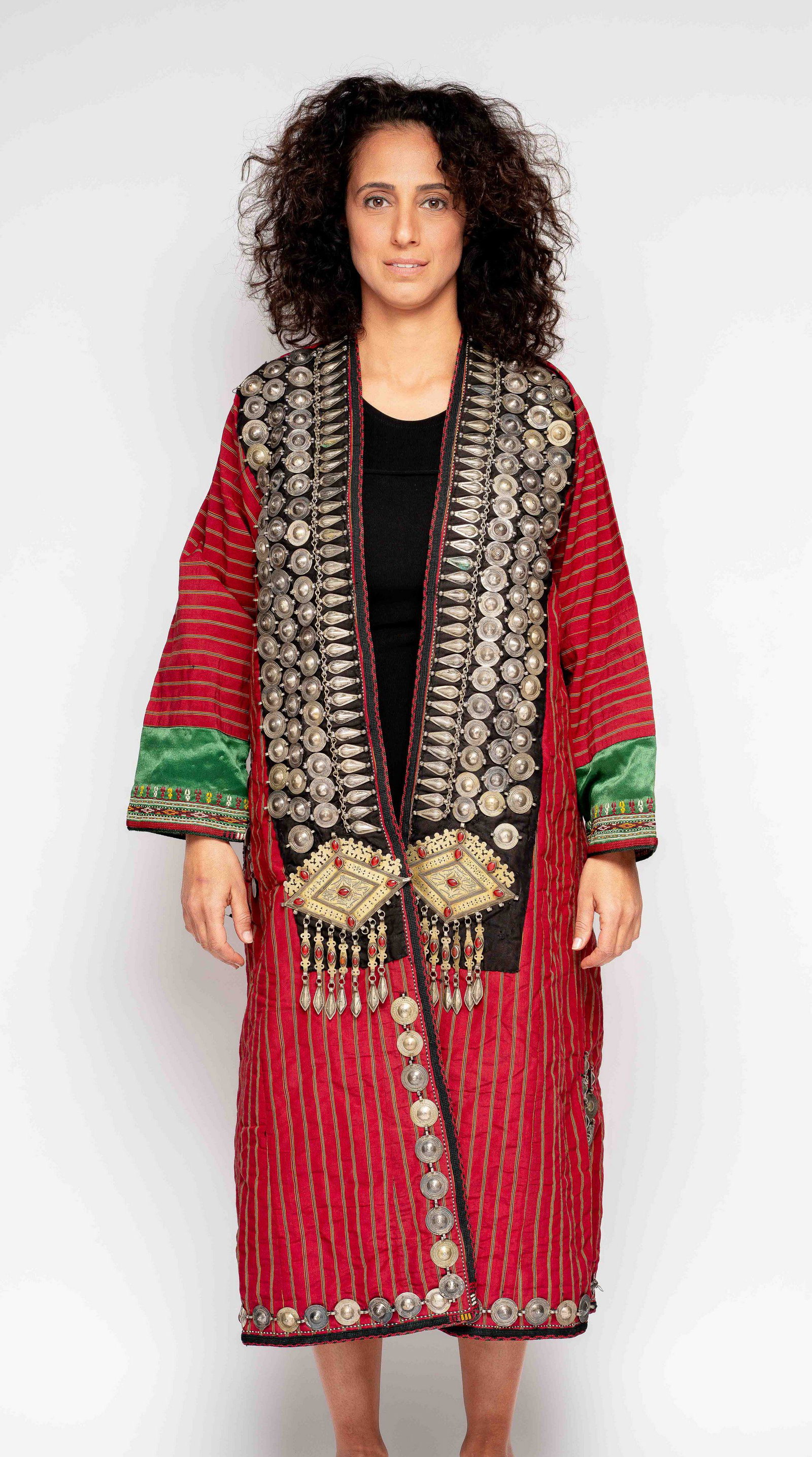 embroidered robe with silver Turkemnistan Islam Turkmen: The robe has medallion and barely shaped elements sewn onto the front and back of the garment. Russian and Islamic coins adorn the back. Two large gilded silver plaques with silver tassels ( some miss