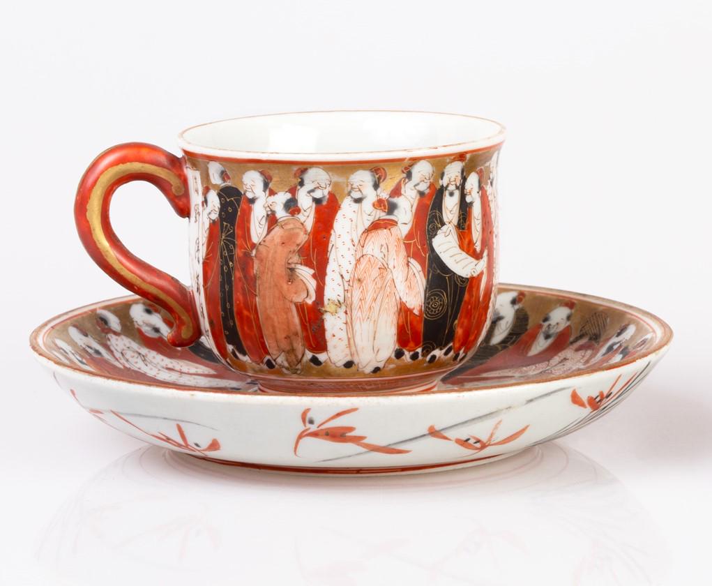 Outstanding Meiji period satsuma cup&saucer: Outstanding, Meiji period satsuma porcelain cup&saucer, depicting people conversing over gold overglaze. Signed. Saucer: W 11.8 cm. Cup: H 4.8 cm, W 7.7 cm.