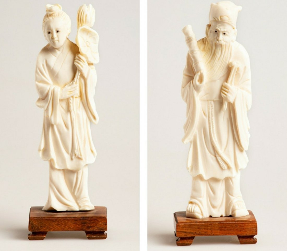 A set of old chinese bone/ antler deities: A set of old chinese bone/ antler deities. 1 is depicting a young boy holding a lotus flower, simbalising longevity, the other is 1 of the 8 immortals of the Dao legancy. 1 with base 14.2 cm, net 13 c