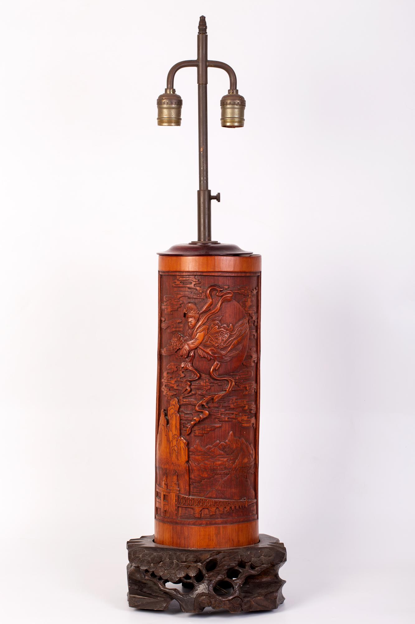 Chinese, bamboo brush pot, modified into a lamp.: An old, 1940s -1950s, Chinese, bamboo brush pot, modified into a lamp. The bamboo brush pot depicting a beautifully carved apsara (female heavenly guardian, flying between the clouds, holding a flower