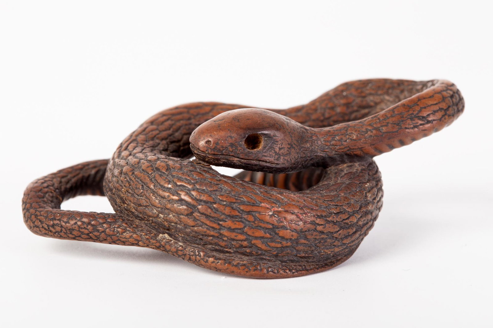 18th century wooden snake netsuke signed 'Shoko' with: The magnificent coiled snake is expertly carved and a fine representation of the wooden netsuke from the Edo period. signed diameter : 3cm comes with an old documentation in French with provenance ( w