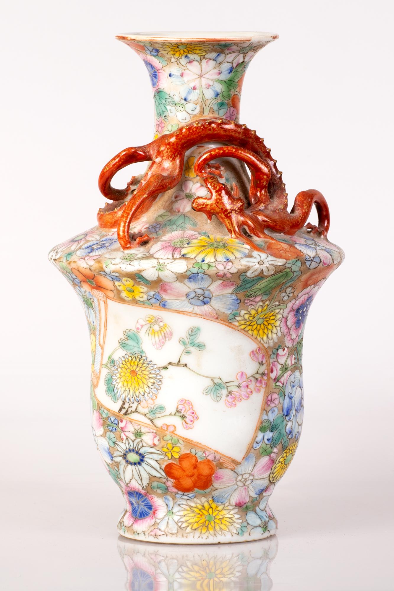 Chinese famille rose dragon vase Qing-Long mark China: The Chinese famile rose porcelain vase is of baluster shape. Decorated with floral work throughout. A red dragon wraps around the neck of the vase. bottom of the vase is hallmarked (Qing long mark but
