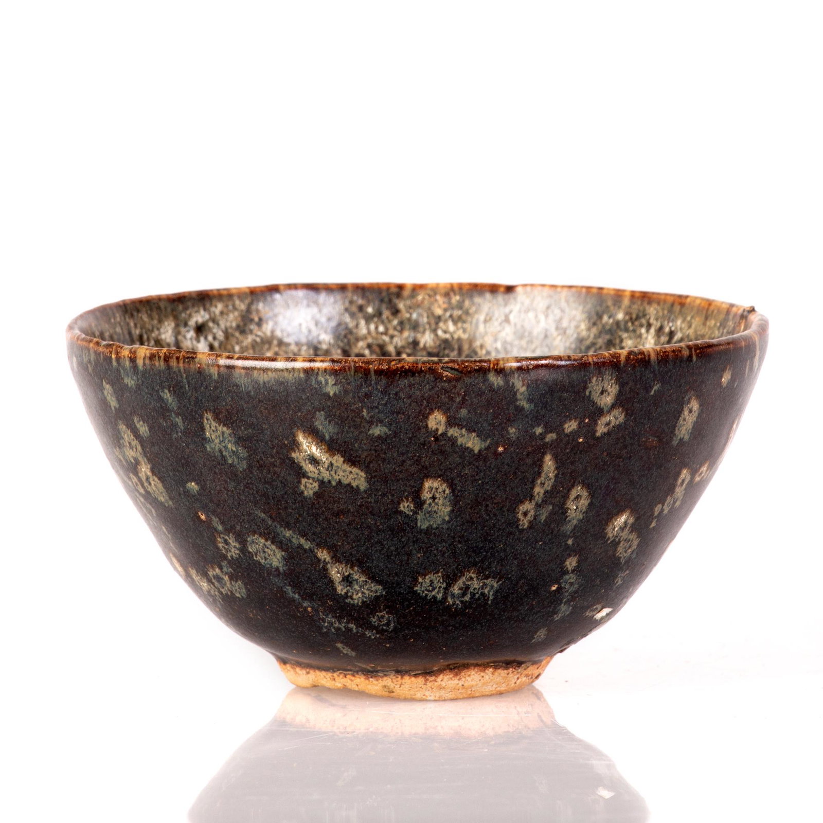an old Chinese Song dynasty style bowl -China: The inside of the bowl is glazed with greenish and white colors. The outside is glazed with black and white. Camels adorn the inside of the bowl. dimensions: 5.5cm*11cm