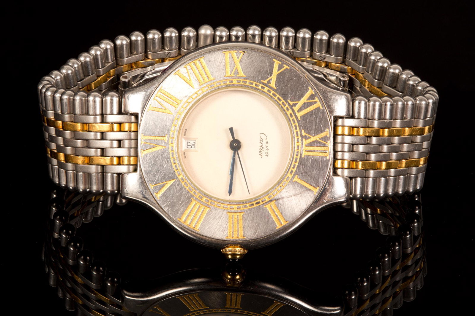 Cartier - Men's\Women's Fashion Watch: Cartier watch, steel with gilded links. Roman numerals, Sapphire stone on the button, original hallmarked band. Quartz movement (functionality not tested) diameter: 36 mm Very good condition, except f