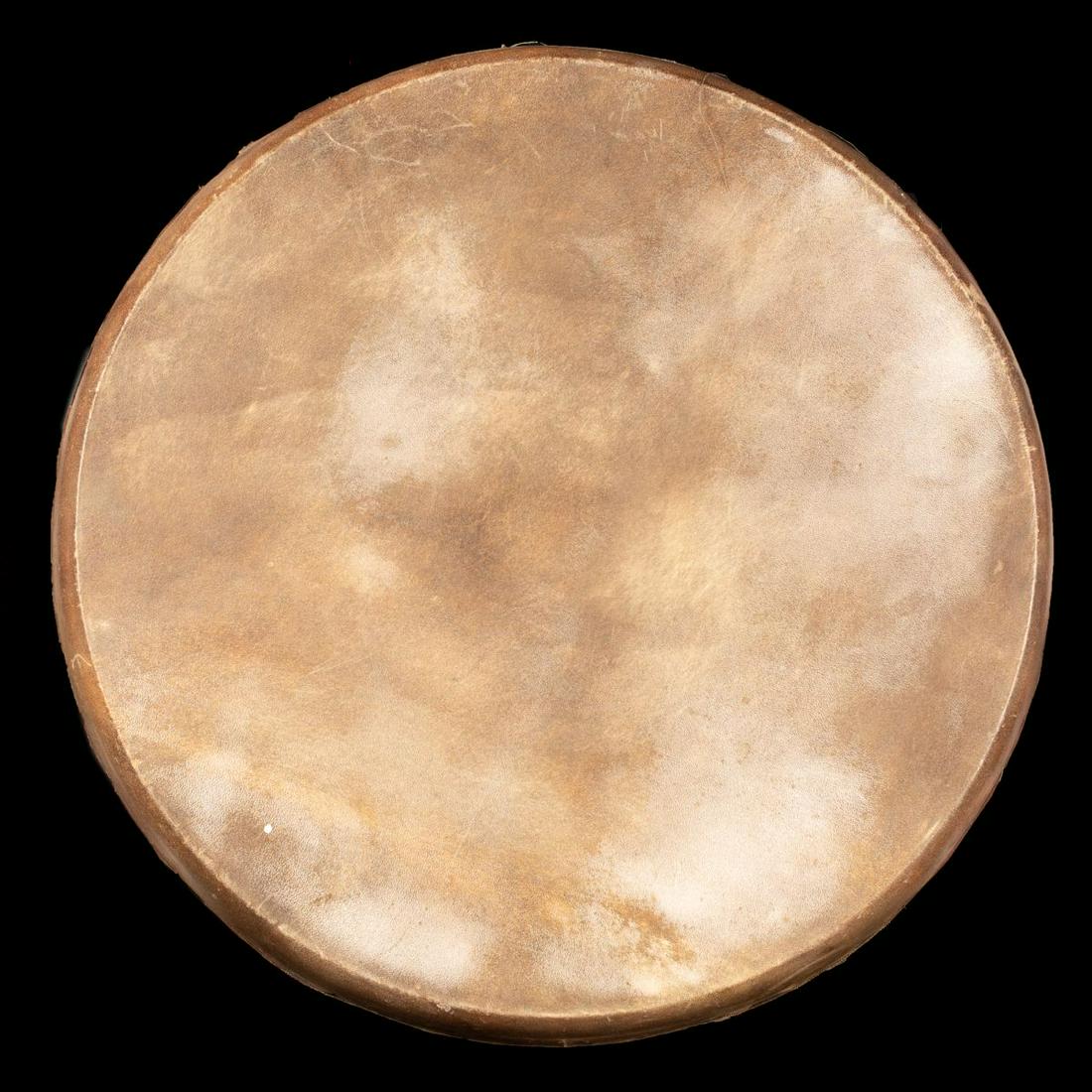 Wood and deerskin Tamborine - Uzbek early 1900's: The tamborineis expertly crafted from deerskin and wood. metal rings hang on the inside for an additional chime. inset with dyed triangular bone ornaments. Some are missing. The tamborine makes a very